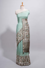 Pastel green Assam Silk saree withfloral woven motifs rich zari border and contrastpallu with fine stripes and tassel detailing along with blouse piece