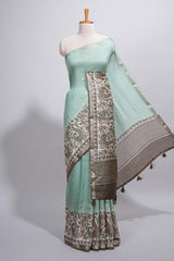 Pastel green Assam Silk saree withfloral woven motifs rich zari border and contrastpallu with fine stripes and tassel detailing along with blouse piece