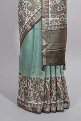 Pastel green Assam Silk saree withfloral woven motifs rich zari border and contrastpallu with fine stripes and tassel detailing along with blouse piece