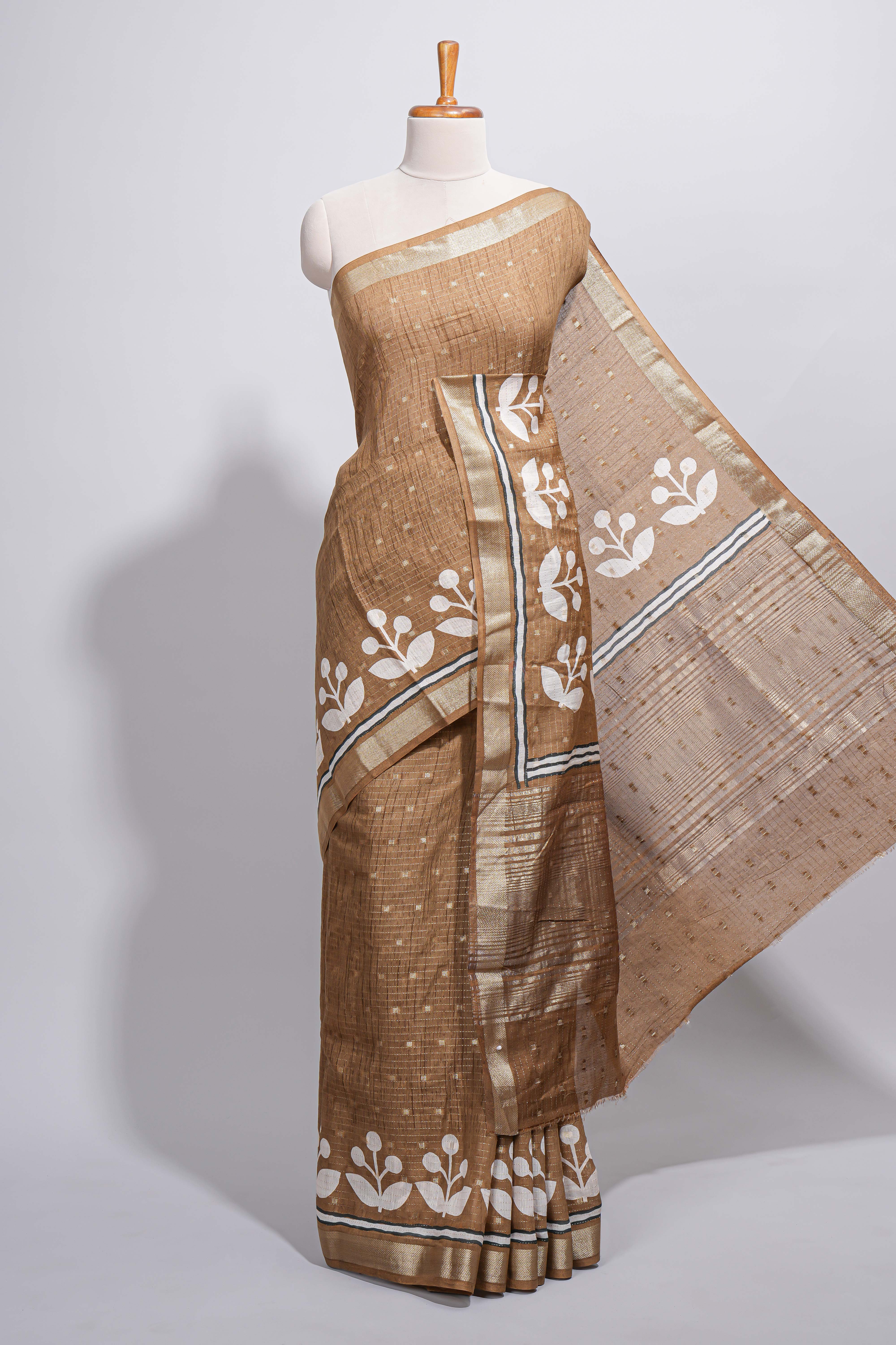 BrownAssam silk saree self-check body with small woven butta motifs and elegant white floral vine prints with zari border along with matching blouse