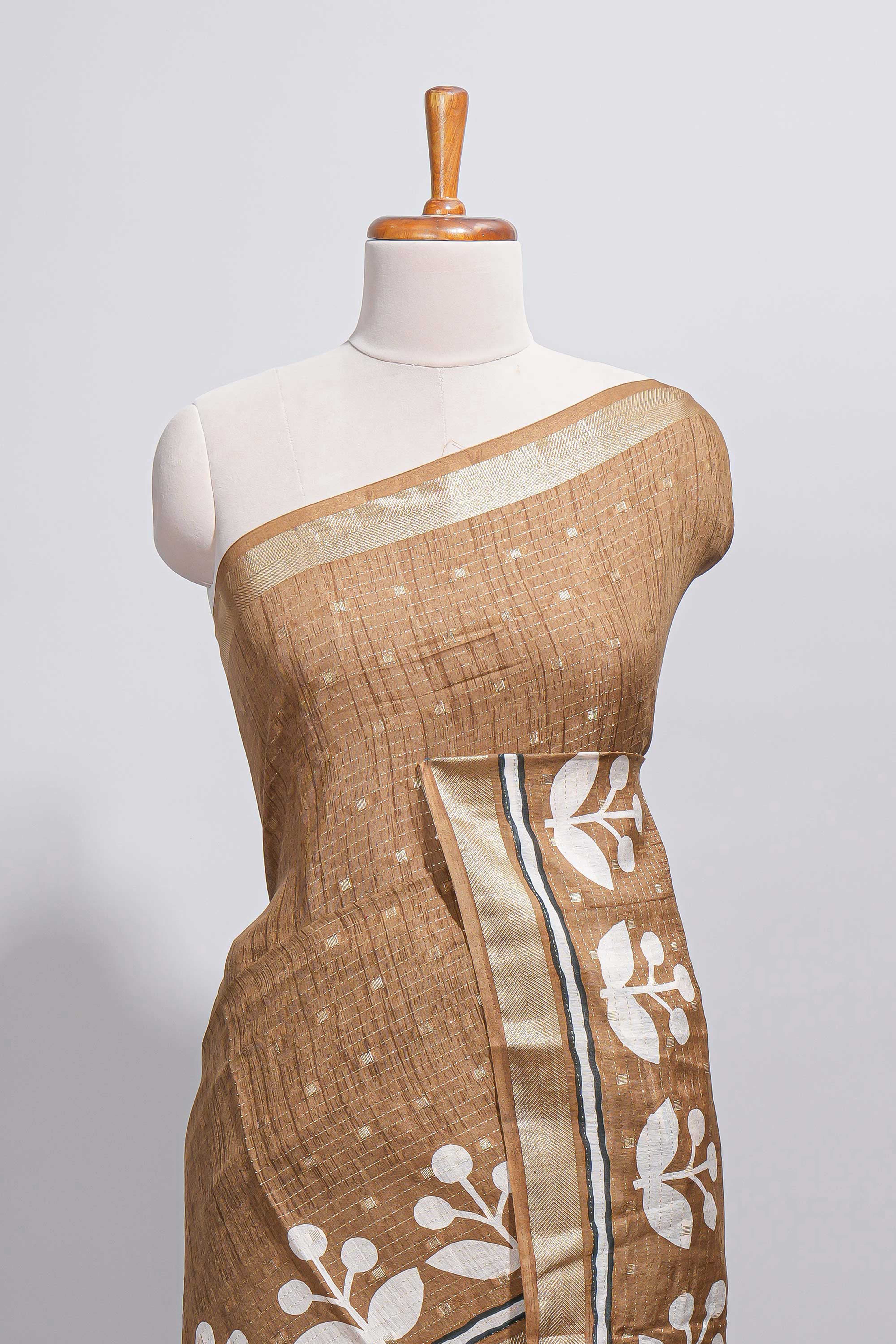 BrownAssam silk saree self-check body with small woven butta motifs and elegant white floral vine prints with zari border along with matching blouse