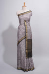 Grey green Assam Silk saree abstract floral line motifs subtle woven details contrast pallu and rich zari border and contrast blouse