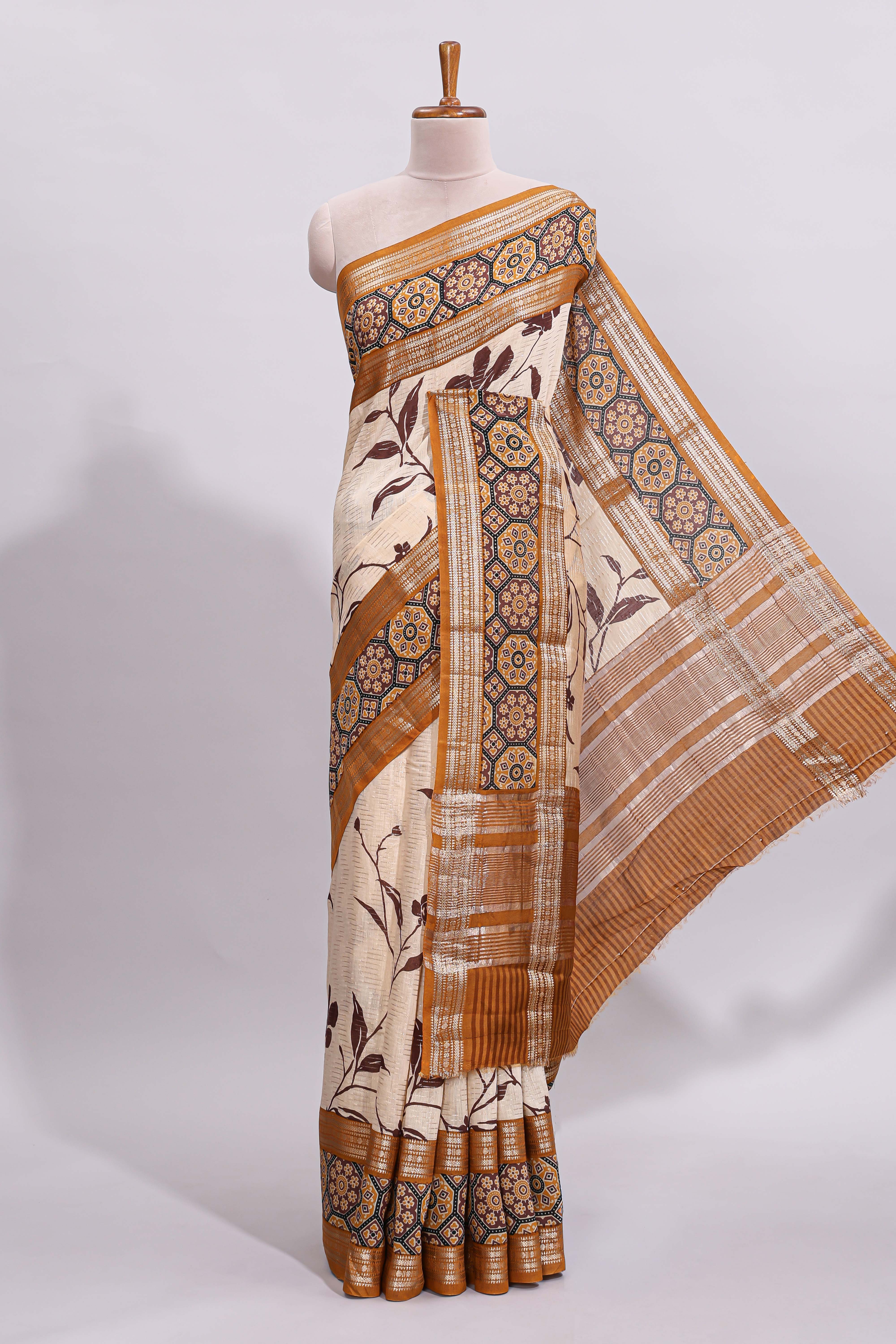 Cream floral design zari striped assam silk saree with contrast zari border and printed blouse