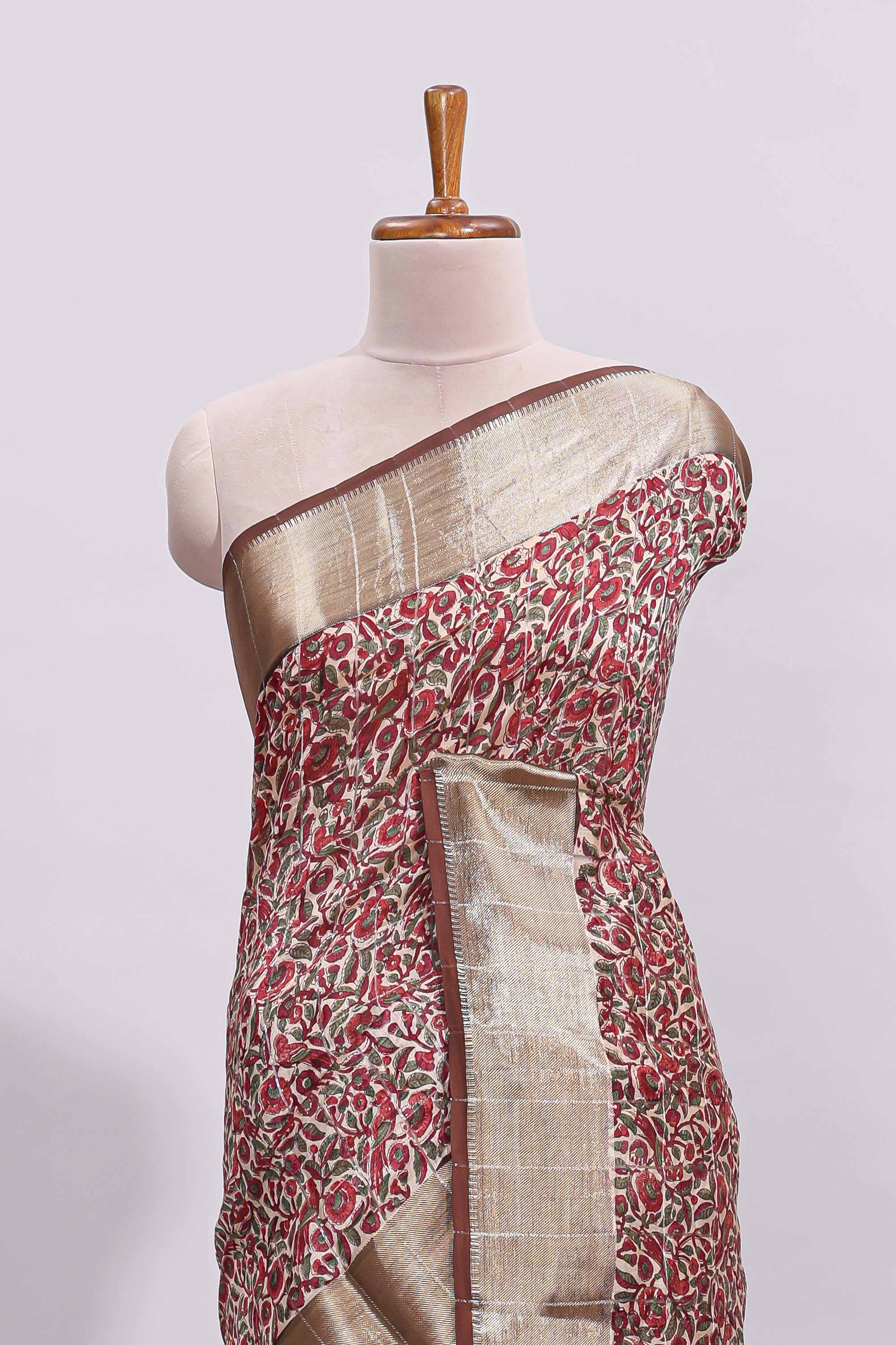 Beige checked floral design assam silk saree with contrast zari border and printed blouse