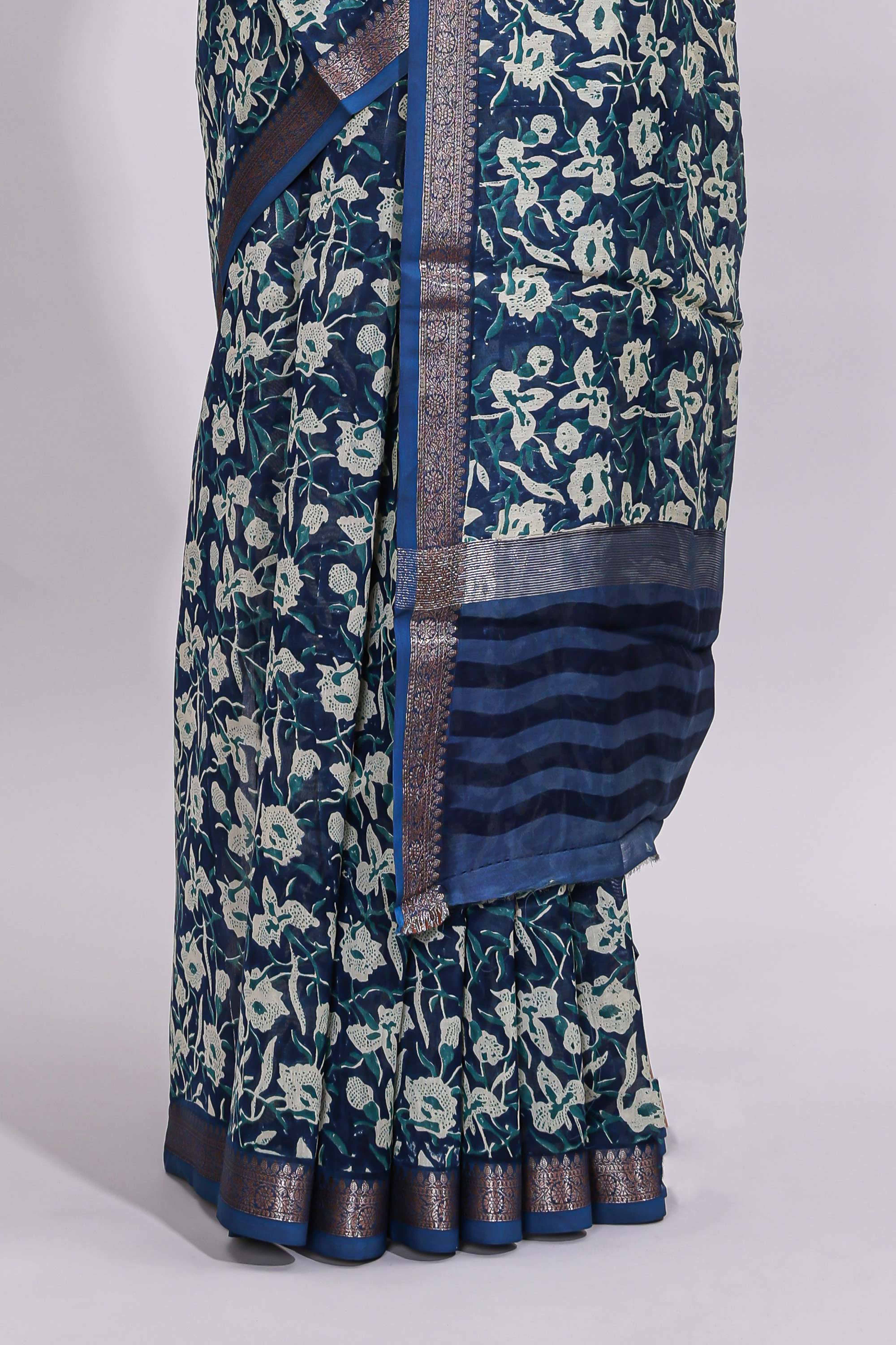 Blue floral design assam silk saree with self zari border and striped blouse