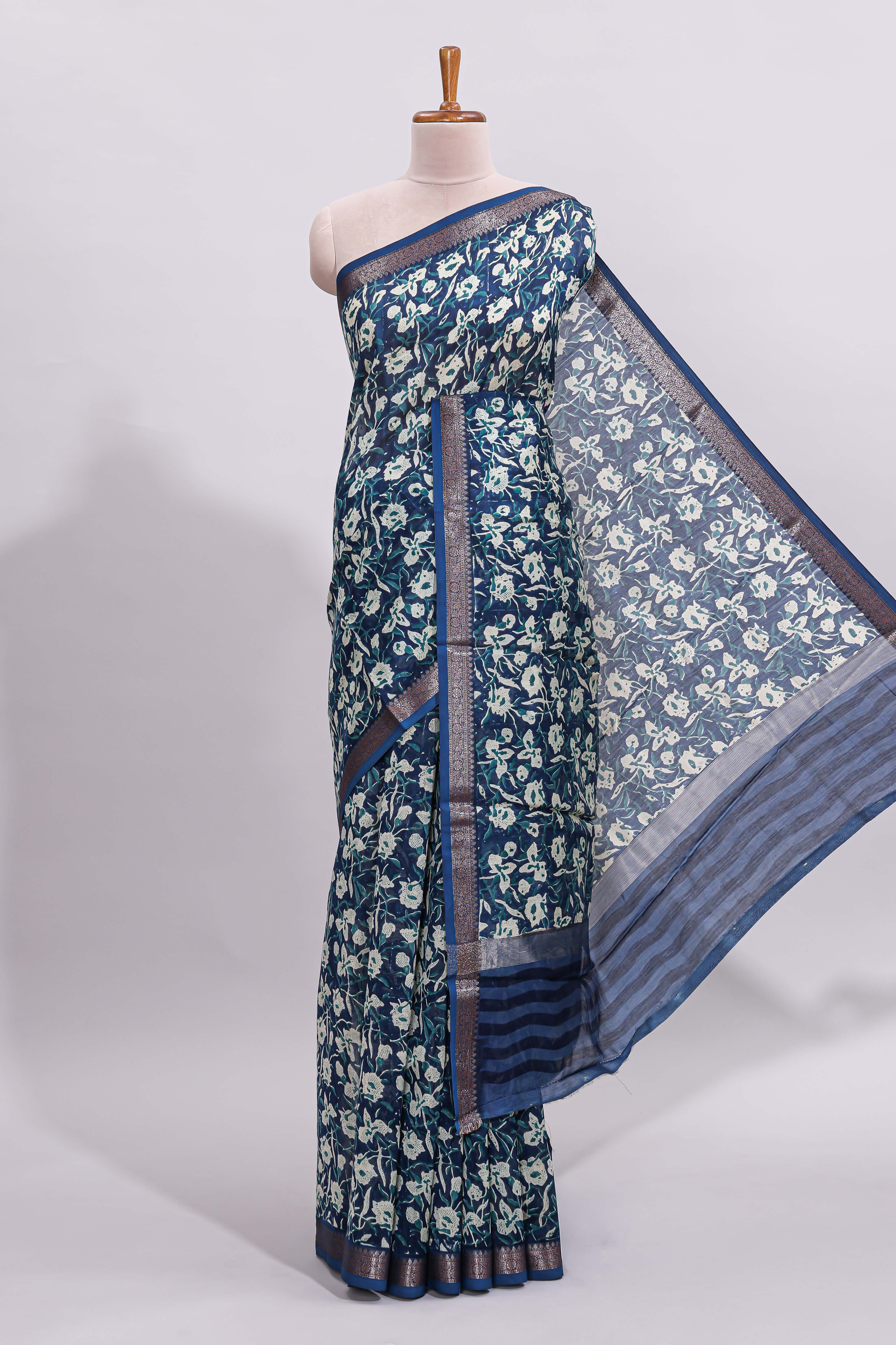 Blue floral design assam silk saree with self zari border and striped blouse