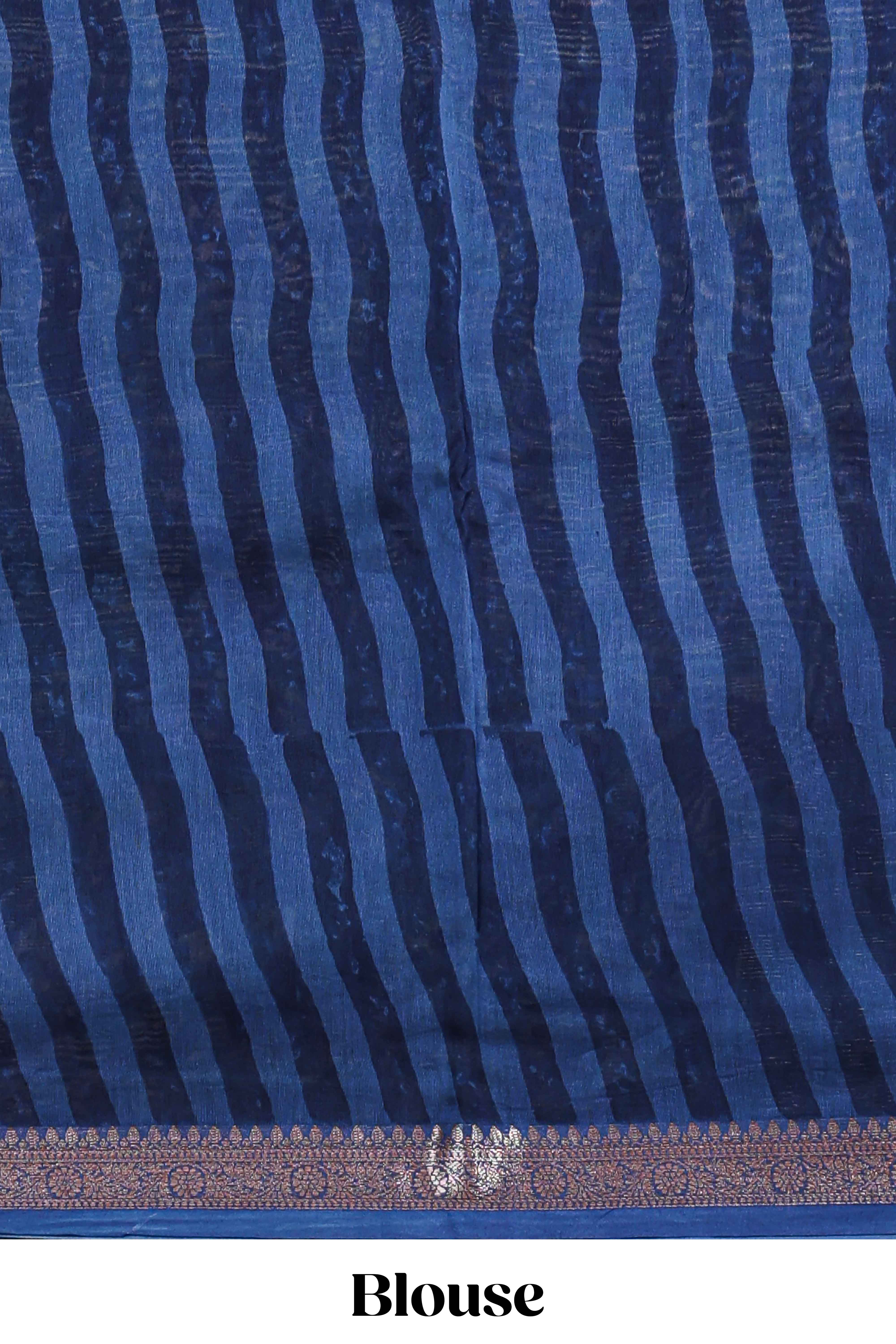 Blue floral design assam silk saree with self zari border and striped blouse
