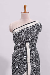 Black ikkat style floral design assam silk saree with self zari border and matching motifs blouse