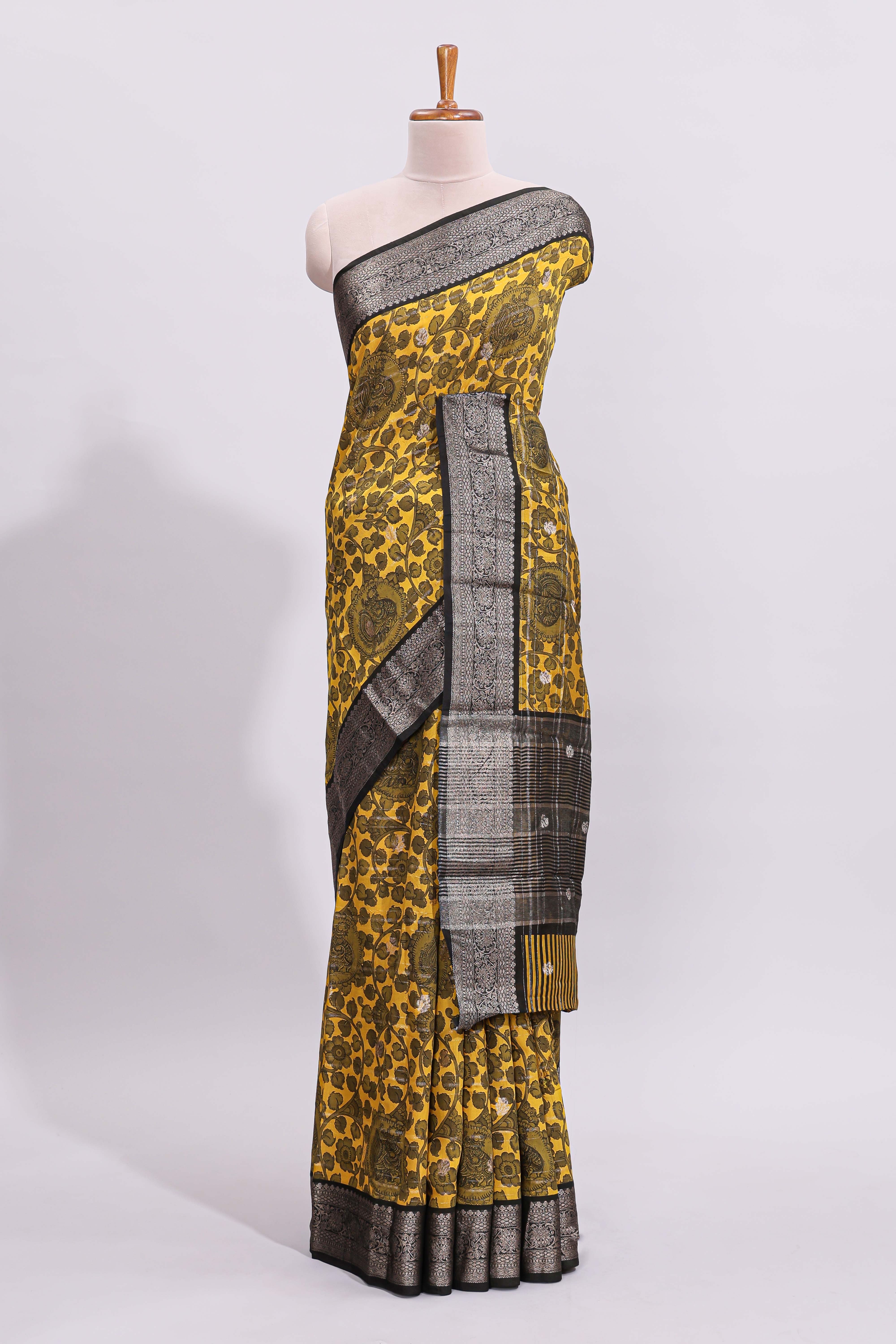 Yellow floral design assam silk saree with contrast zari border and matching motifs blouse