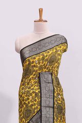 Yellow floral design assam silk saree with contrast zari border and matching motifs blouse