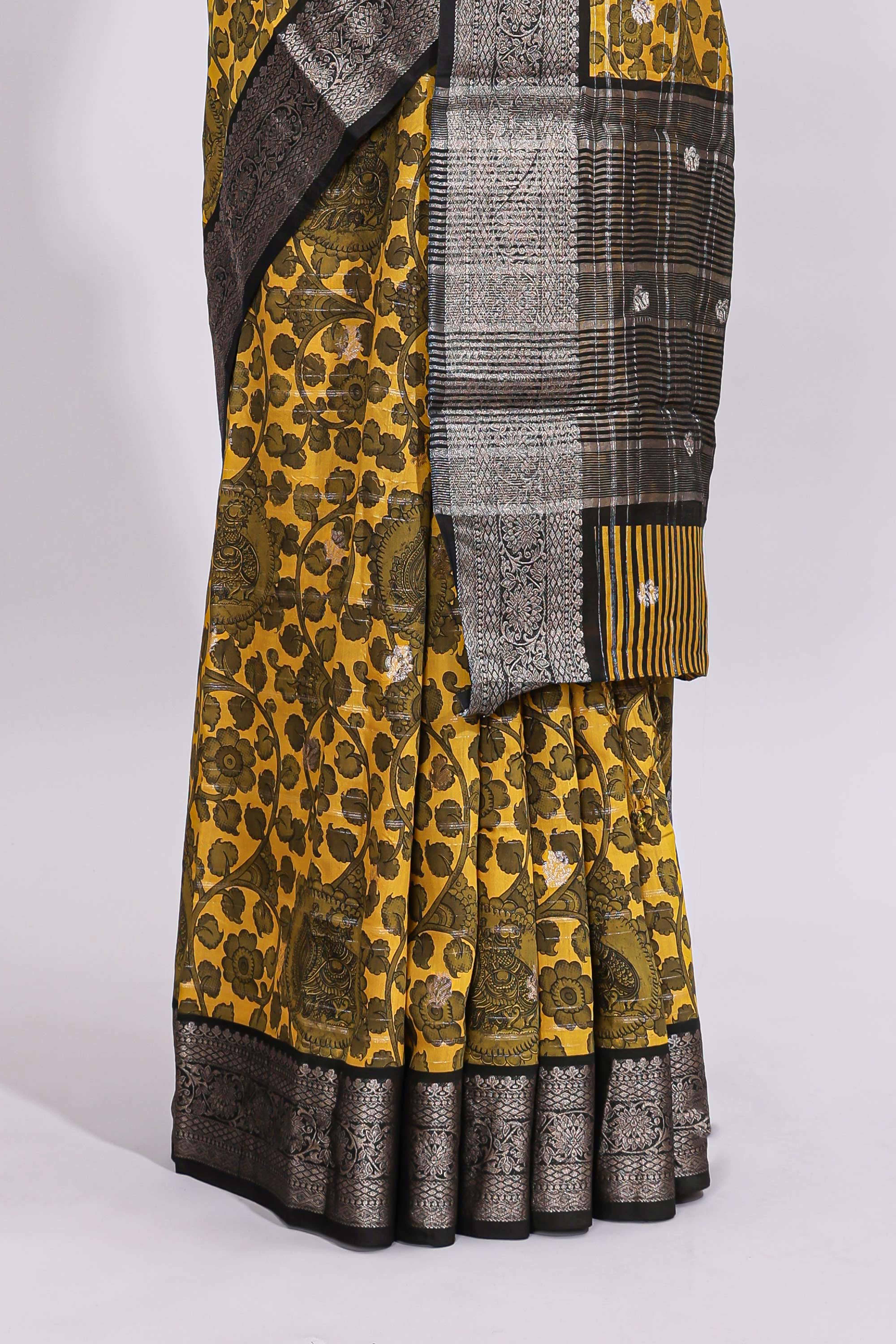 Yellow floral design assam silk saree with contrast zari border and matching motifs blouse