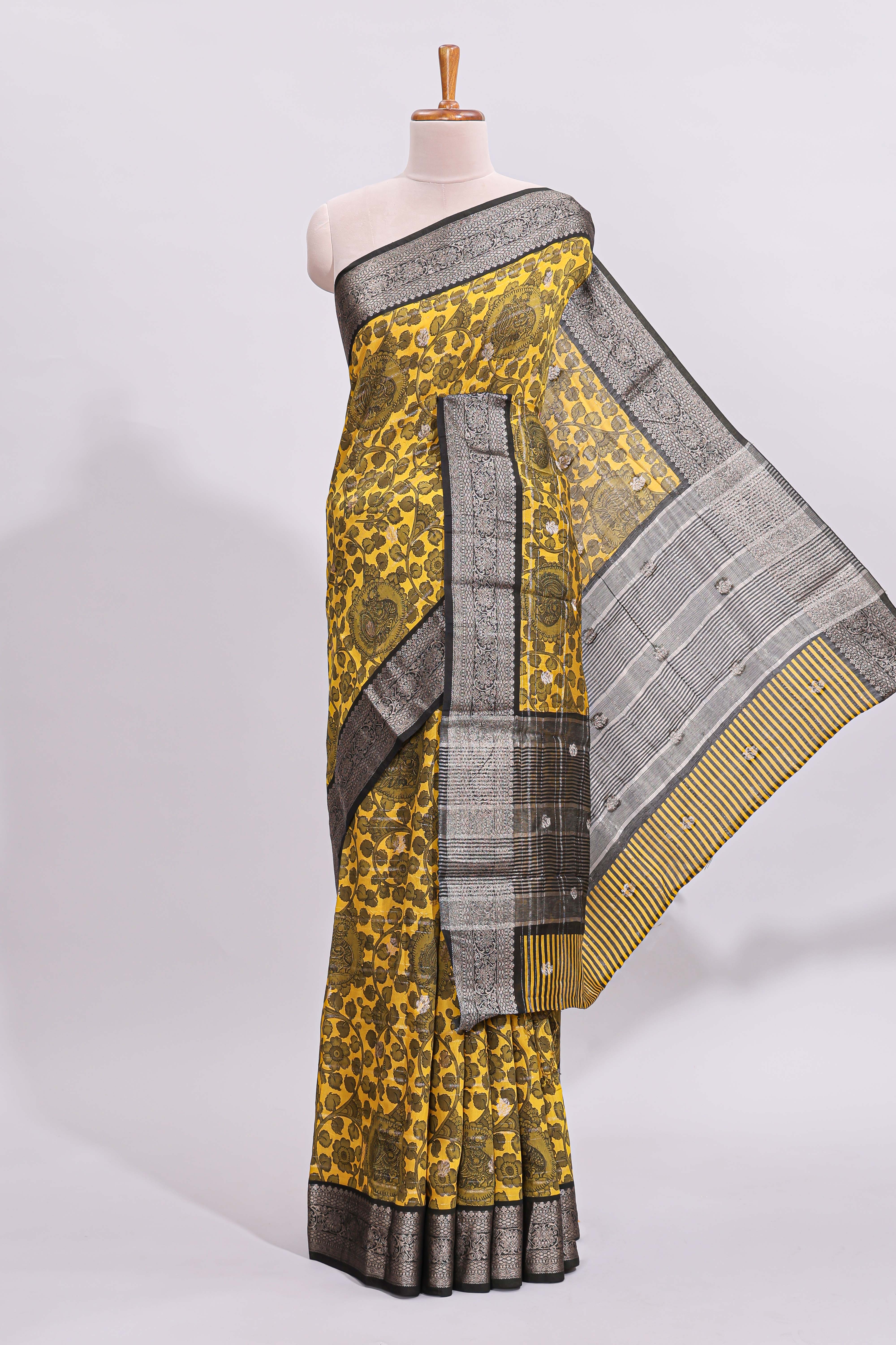 Yellow floral design assam silk saree with contrast zari border and matching motifs blouse