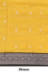Yellow floral design assam silk saree with contrast zari border and matching motifs blouse