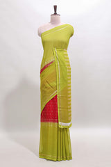 Red zari butta semi soft silk saree with contrast border and zari striped pallu