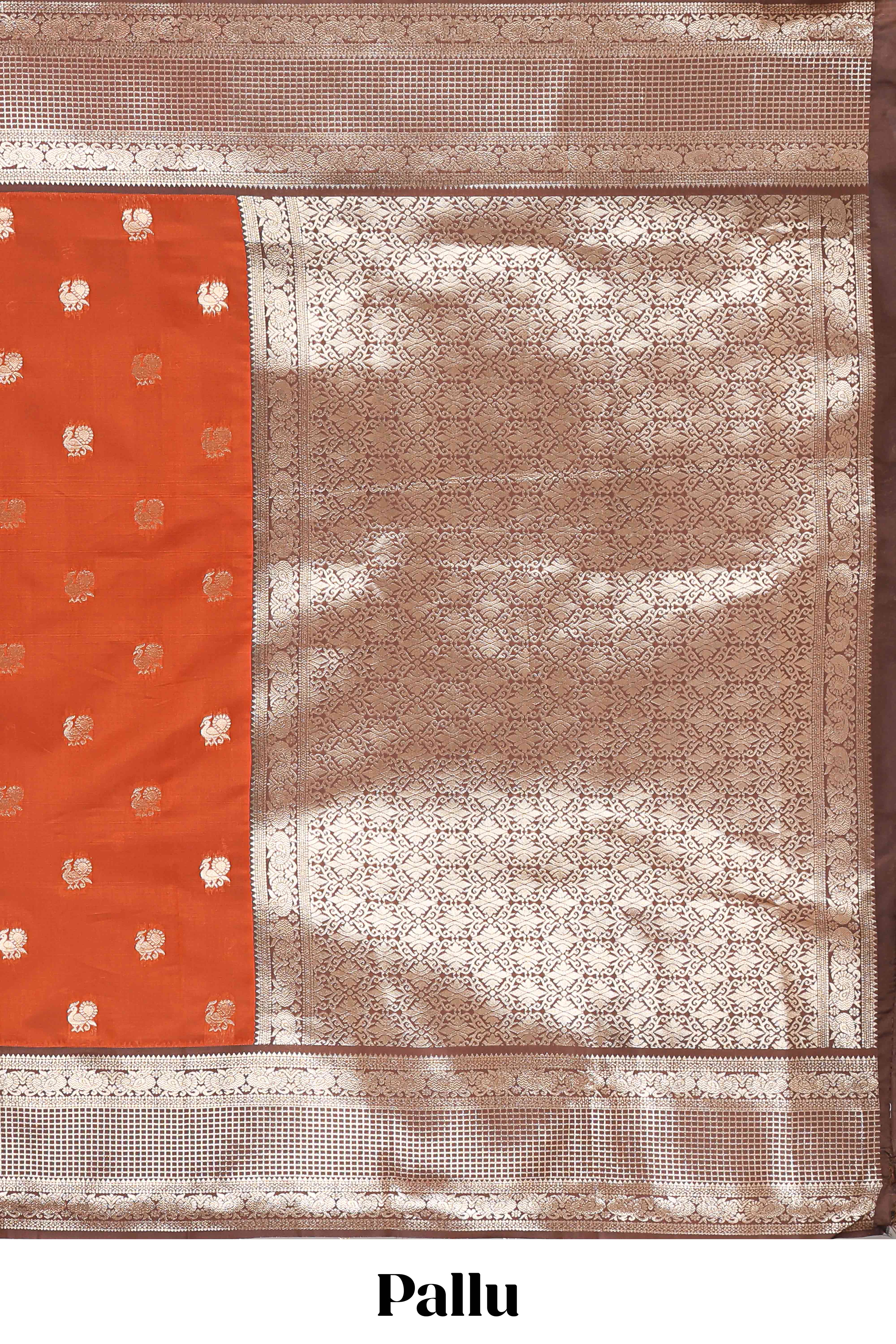Rust orange peacock zari motifs design semi soft silk saree with contrast zari border and pallu