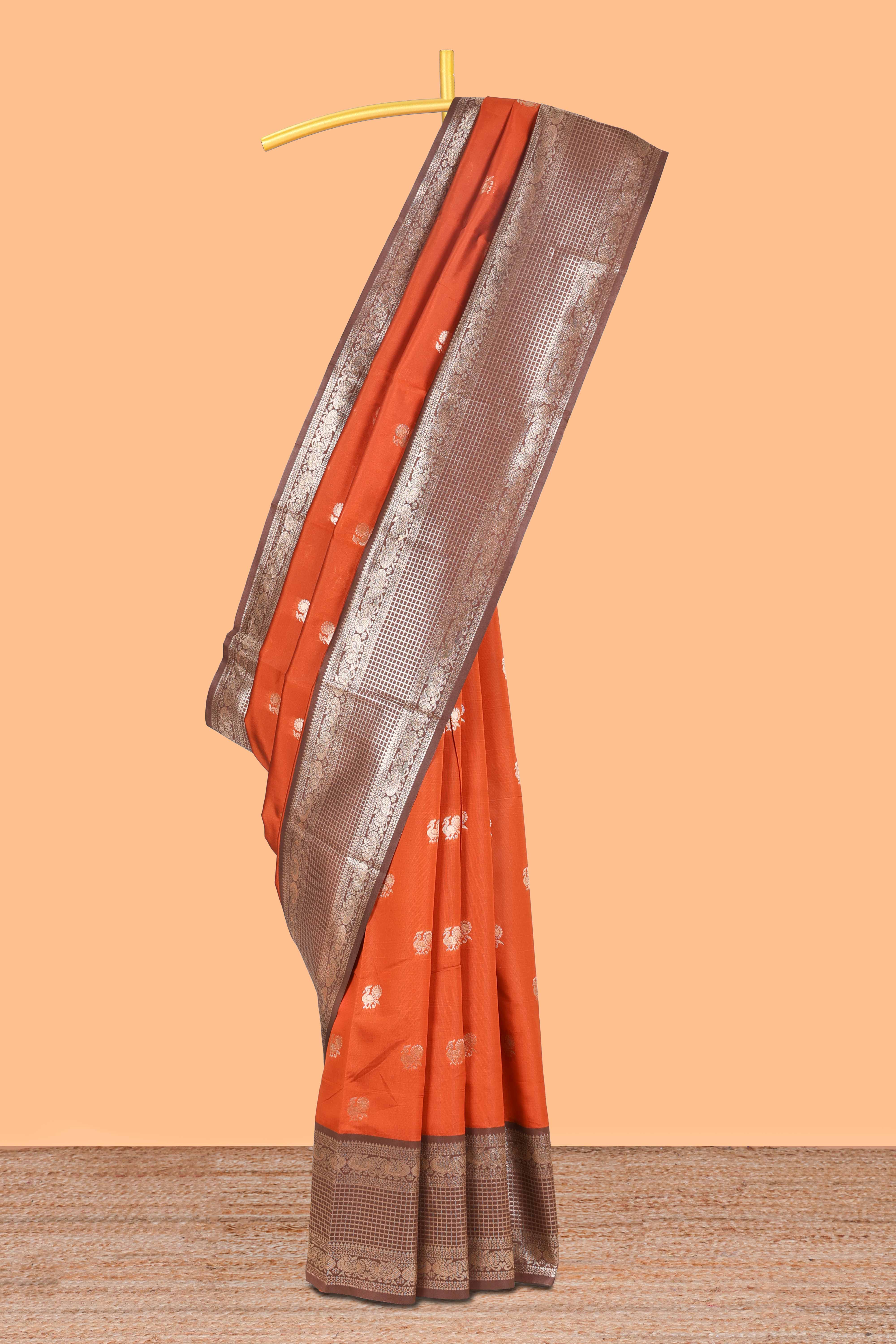 Rust orange peacock zari motifs design semi soft silk saree with contrast zari border and pallu
