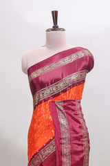 Orange zari butta semi soft silk saree with contrast bentex border and zari striped pallu