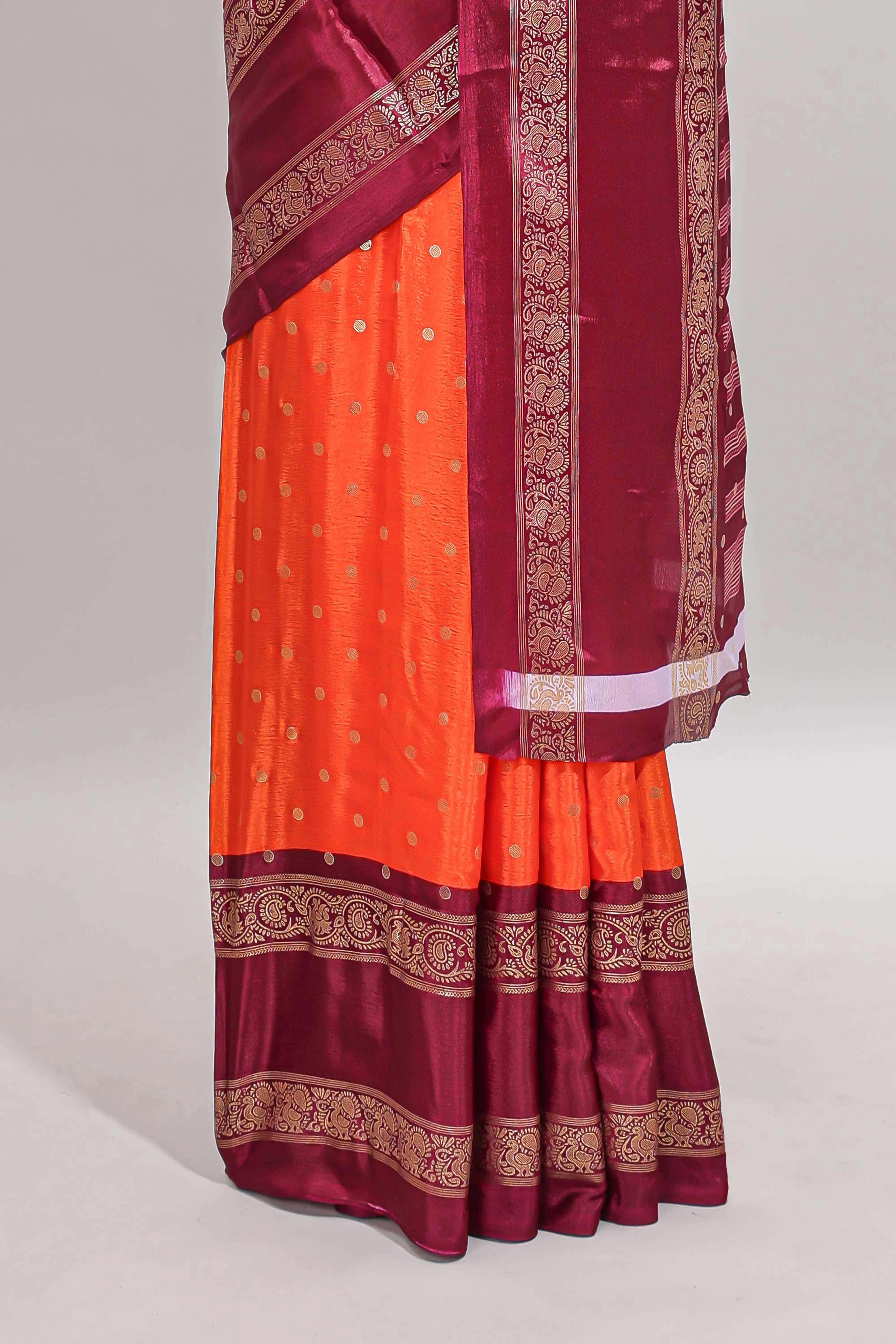 Orange zari butta semi soft silk saree with contrast bentex border and zari striped pallu