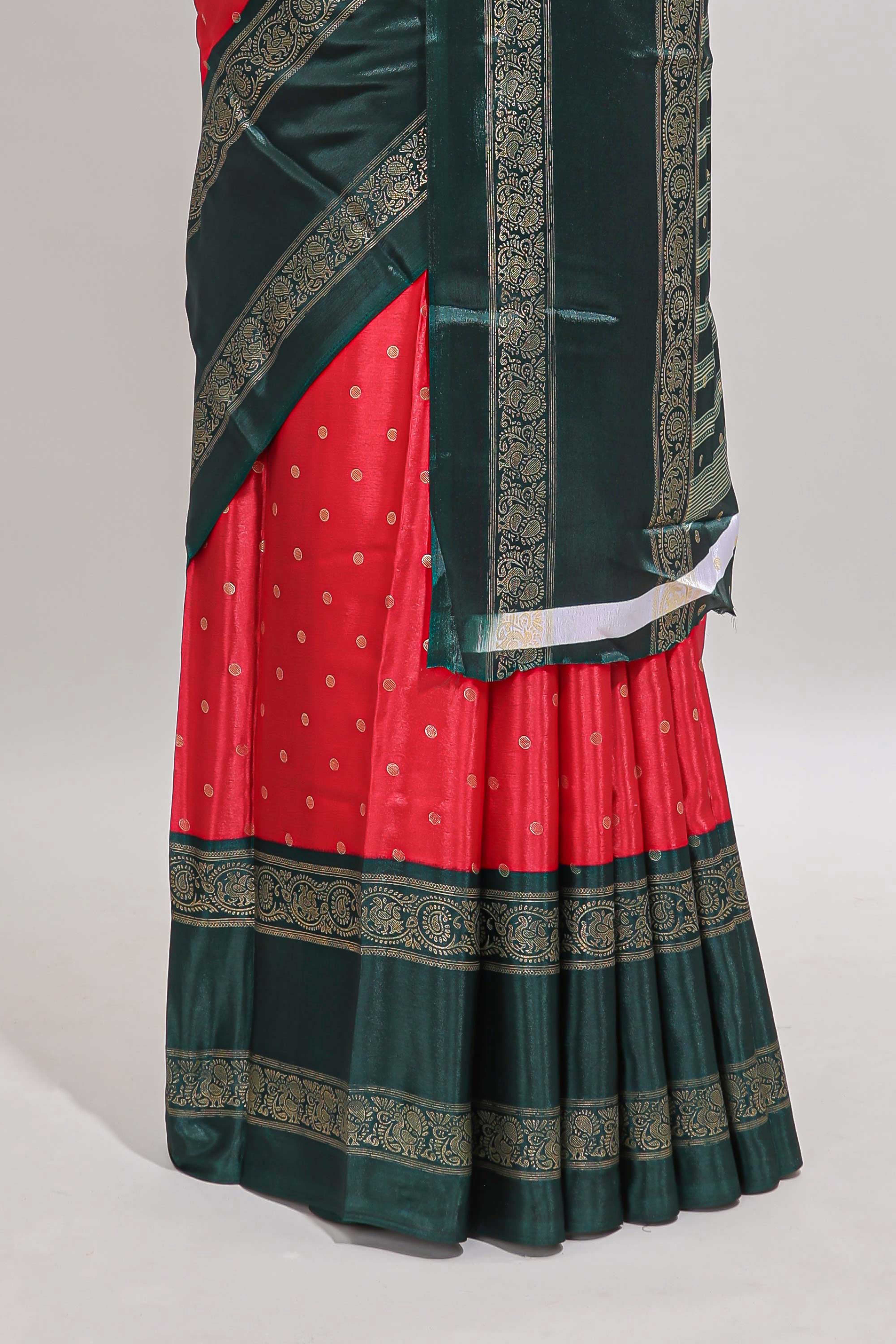 Red zari butta semi soft silk saree with contrast green bentex border and zari striped pallu