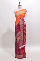 Orange & maroon dual shade zari motifs semi soft silk saree with self border and striped pallu