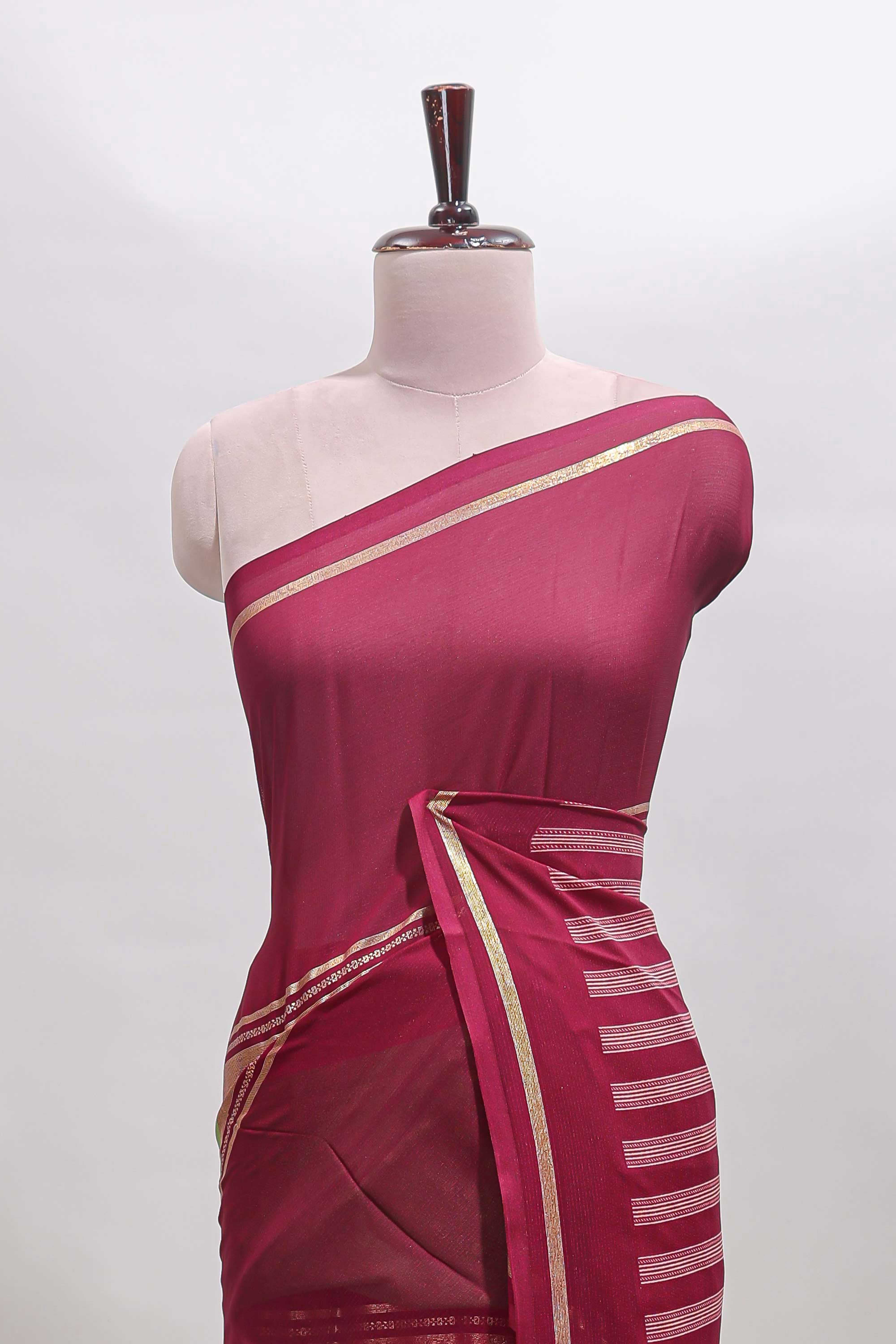 Green zari motifs semi soft silk saree with contrast border and striped pallu