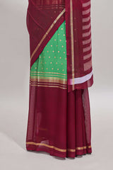 Green zari motifs semi soft silk saree with contrast border and striped pallu