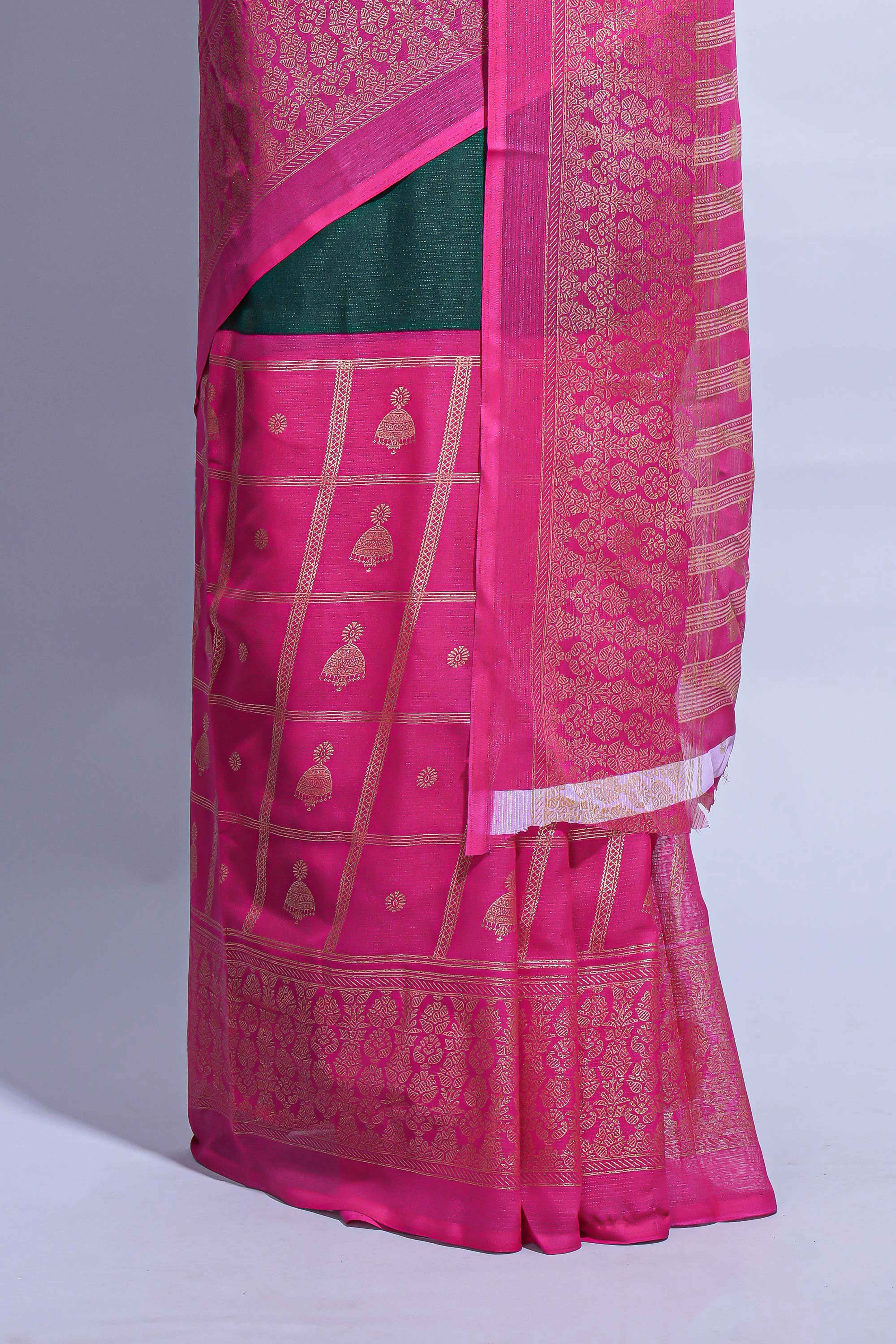 Dark green color budget silk saree with contrast foil print border and contrast pallu along with contrast blouse piece