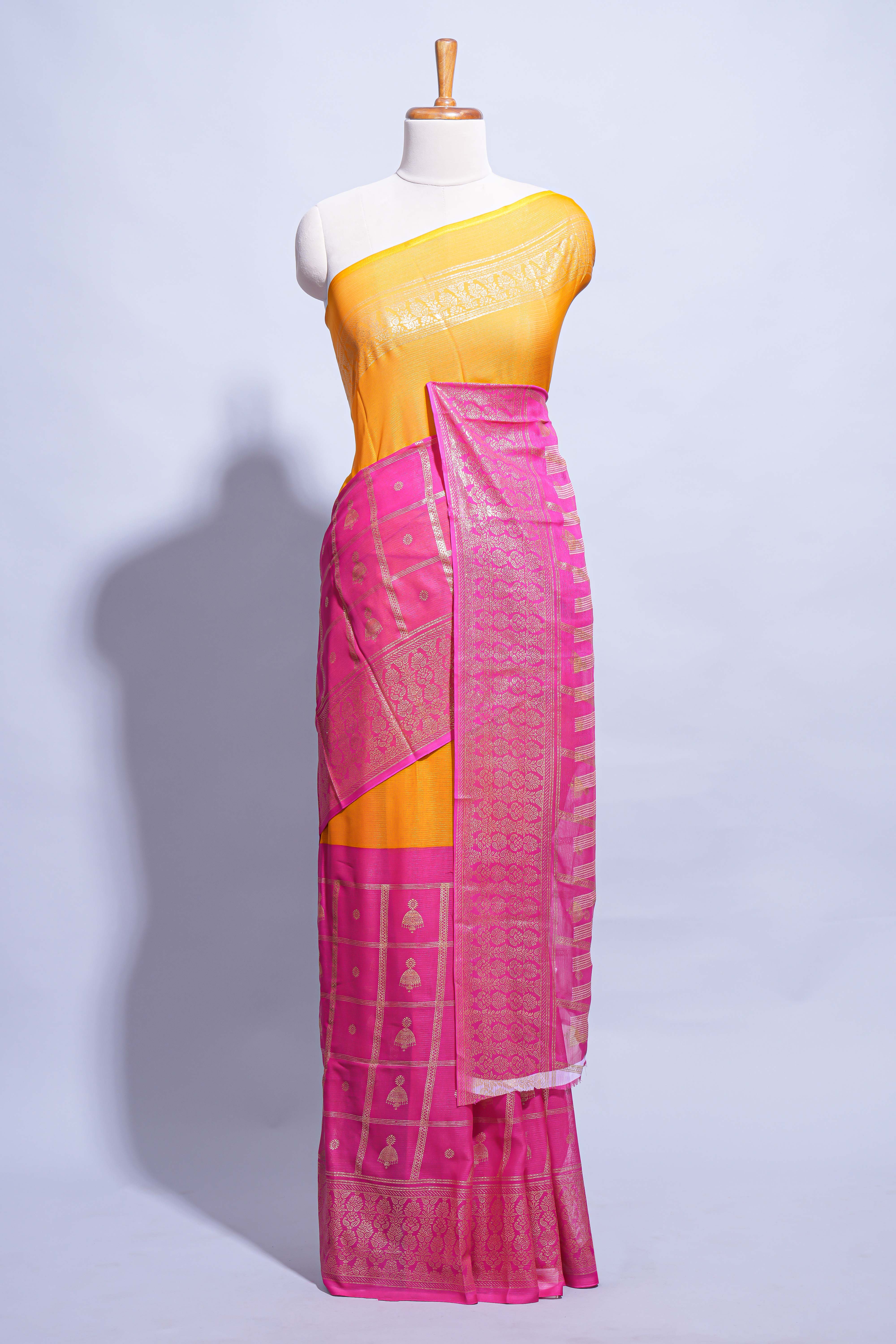 Yellow color budget silk saree with contrast foil print border and contrast pallu along with contrast blouse piece