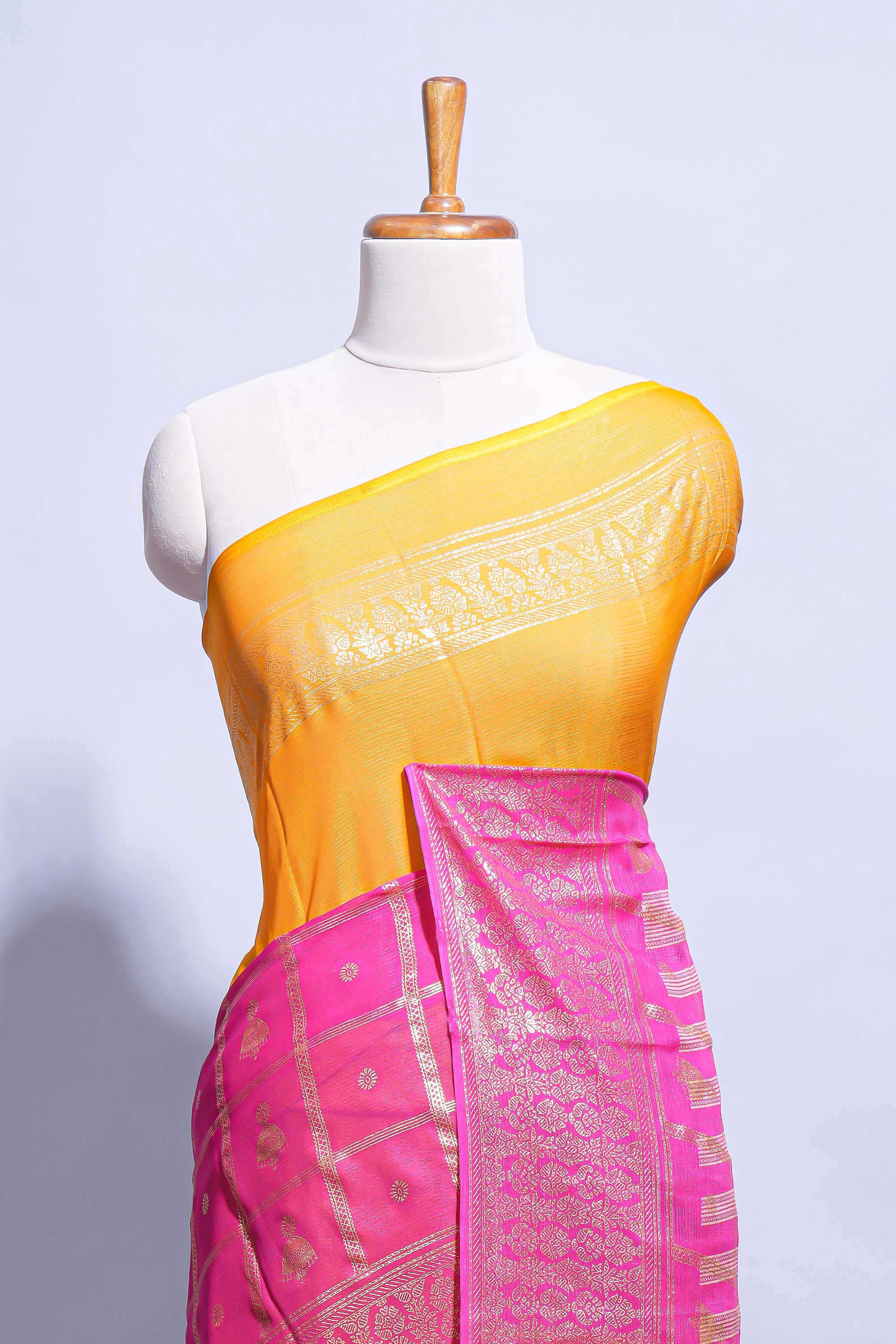 Yellow color budget silk saree with contrast foil print border and contrast pallu along with contrast blouse piece