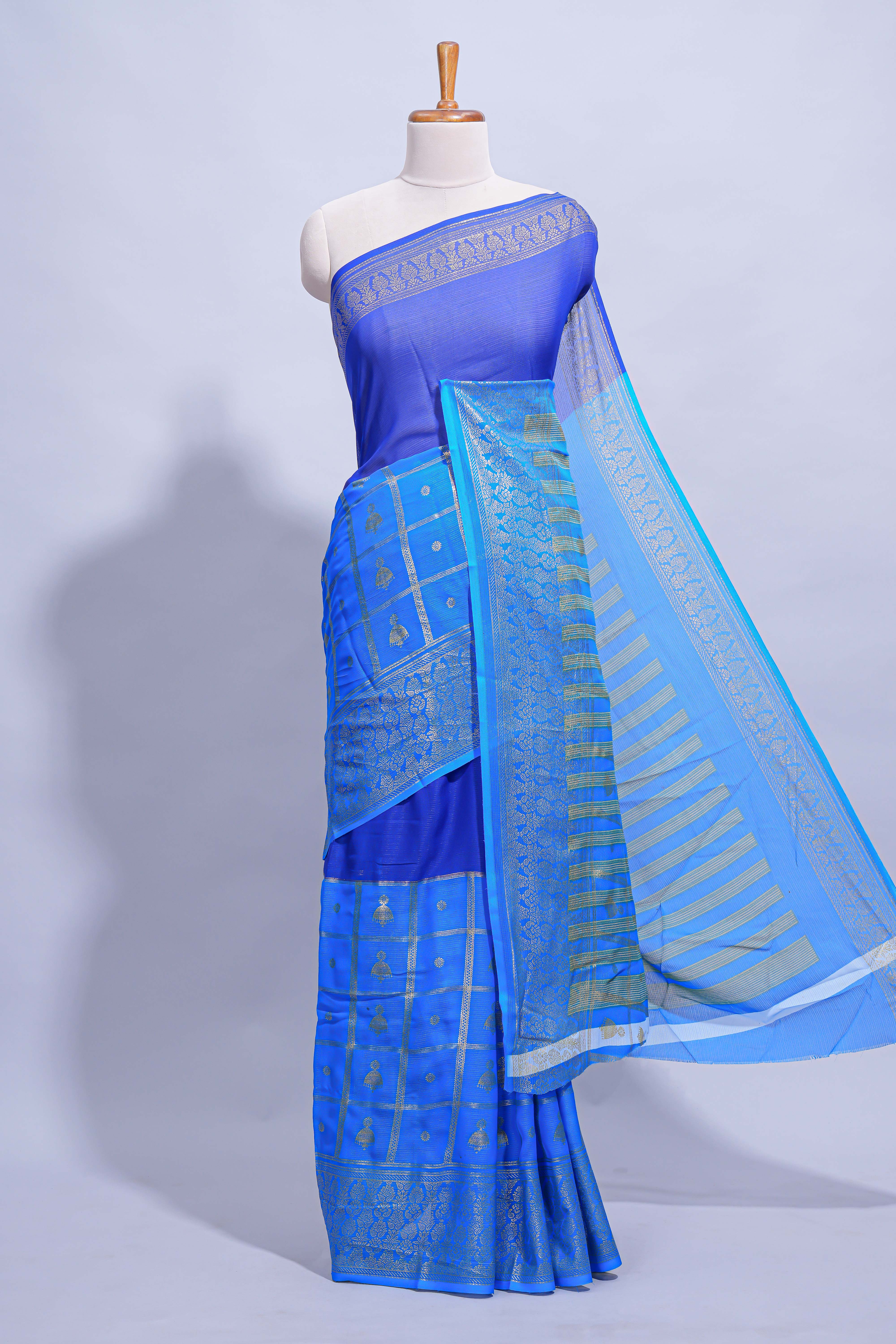Royal blue color budget silk saree with contrast foil print border and contrast pallu along with contrast blouse piece