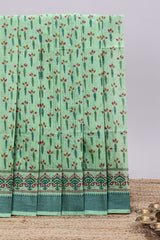 Green checked floral design chirala cotton saree with self border and printed blouse