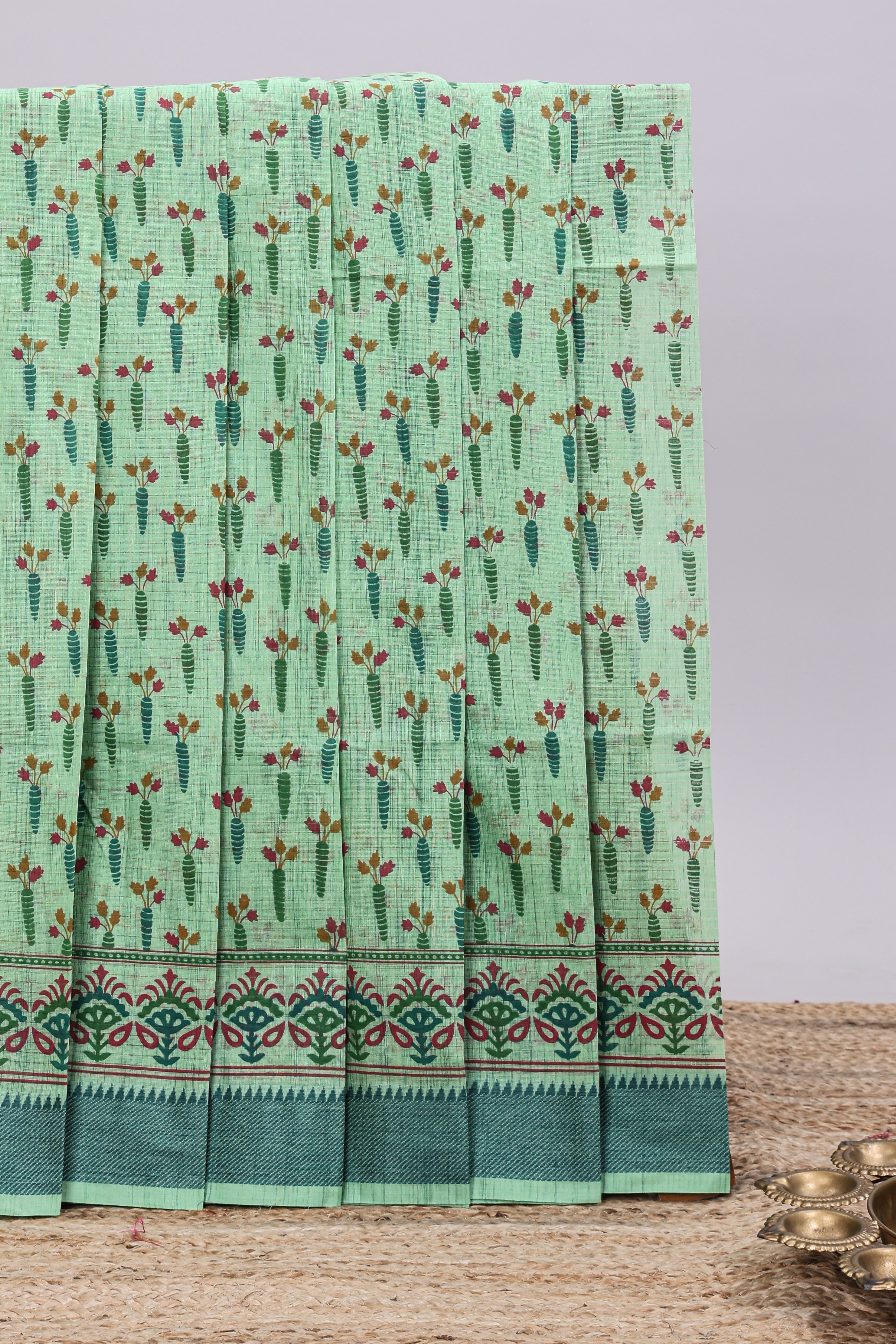 Green checked floral design chirala cotton saree with self border and printed blouse