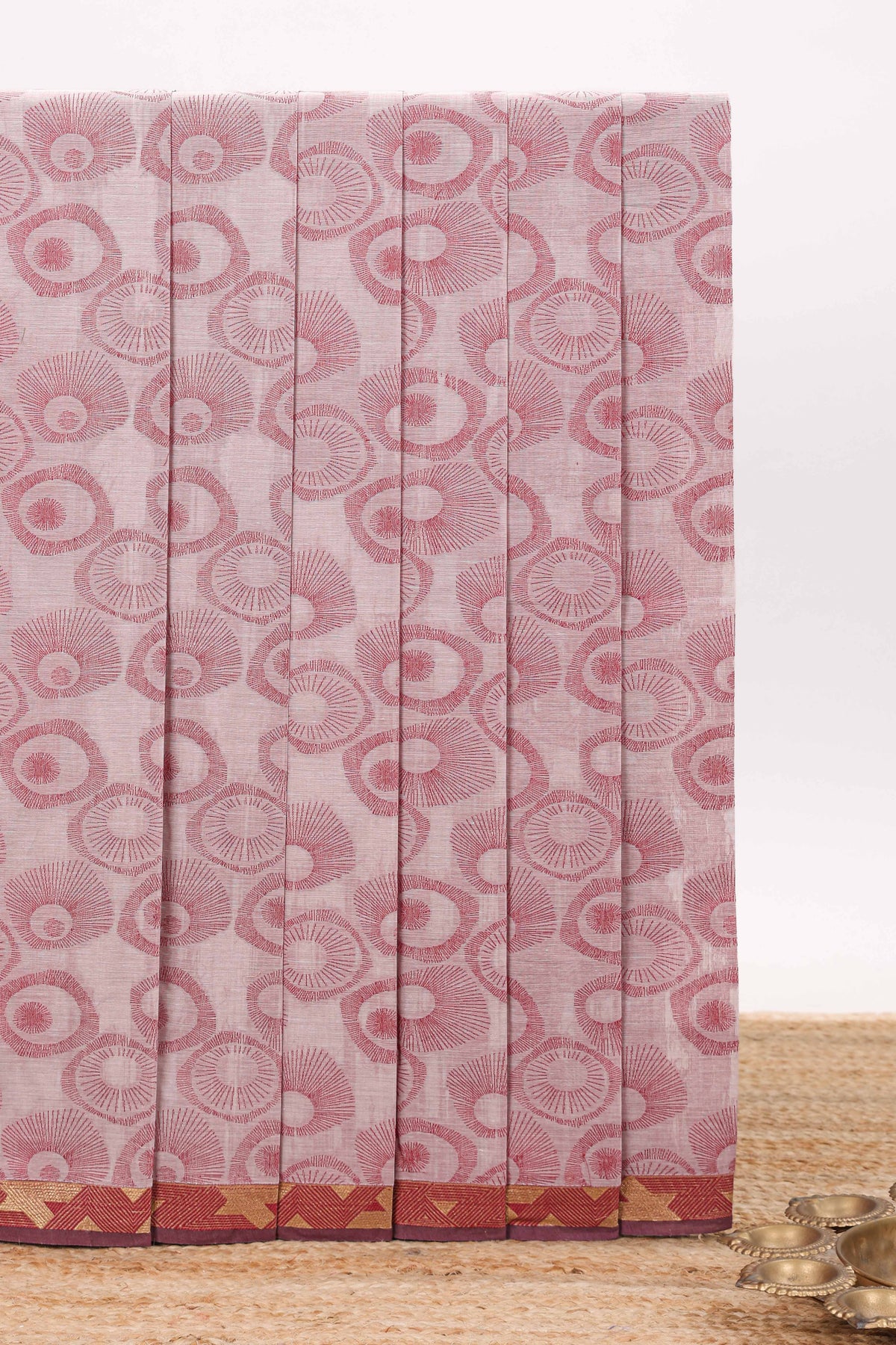 Dusty pink unique designed chirala cotton saree with contrast border and self geometric designed pallu