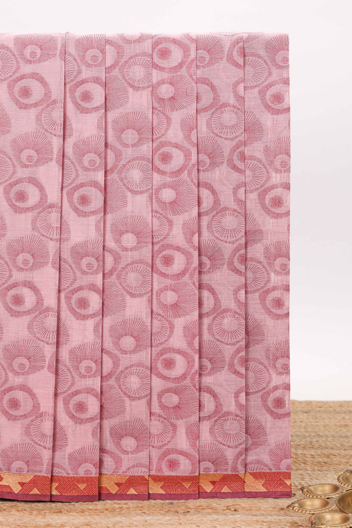 Pink unique designed chirala cotton saree with contrast border and self geometric motif pallu