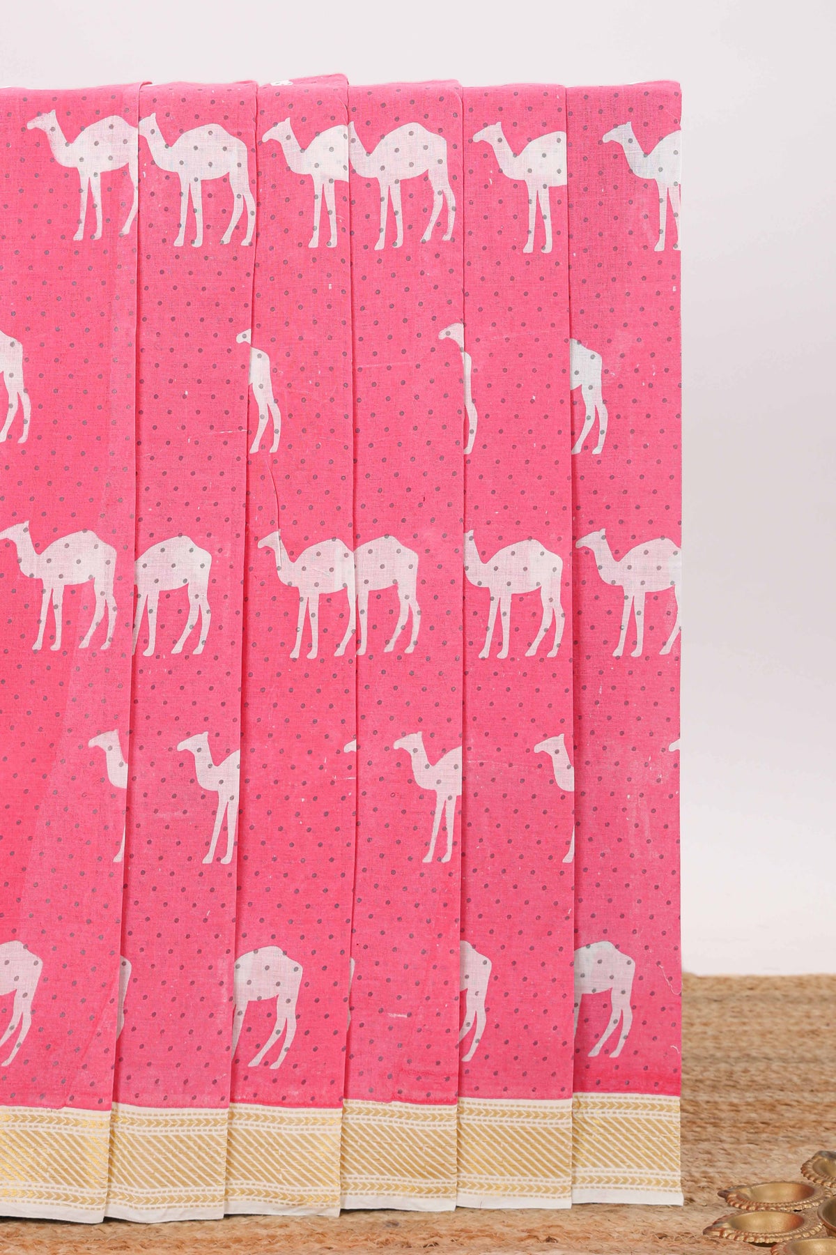 Pink camel motif chirala cotton saree with contrast zari border and blouse