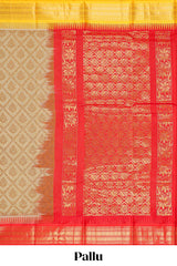 Beige geometric floral design chirala cotton saree with contrast border and zari design pallu