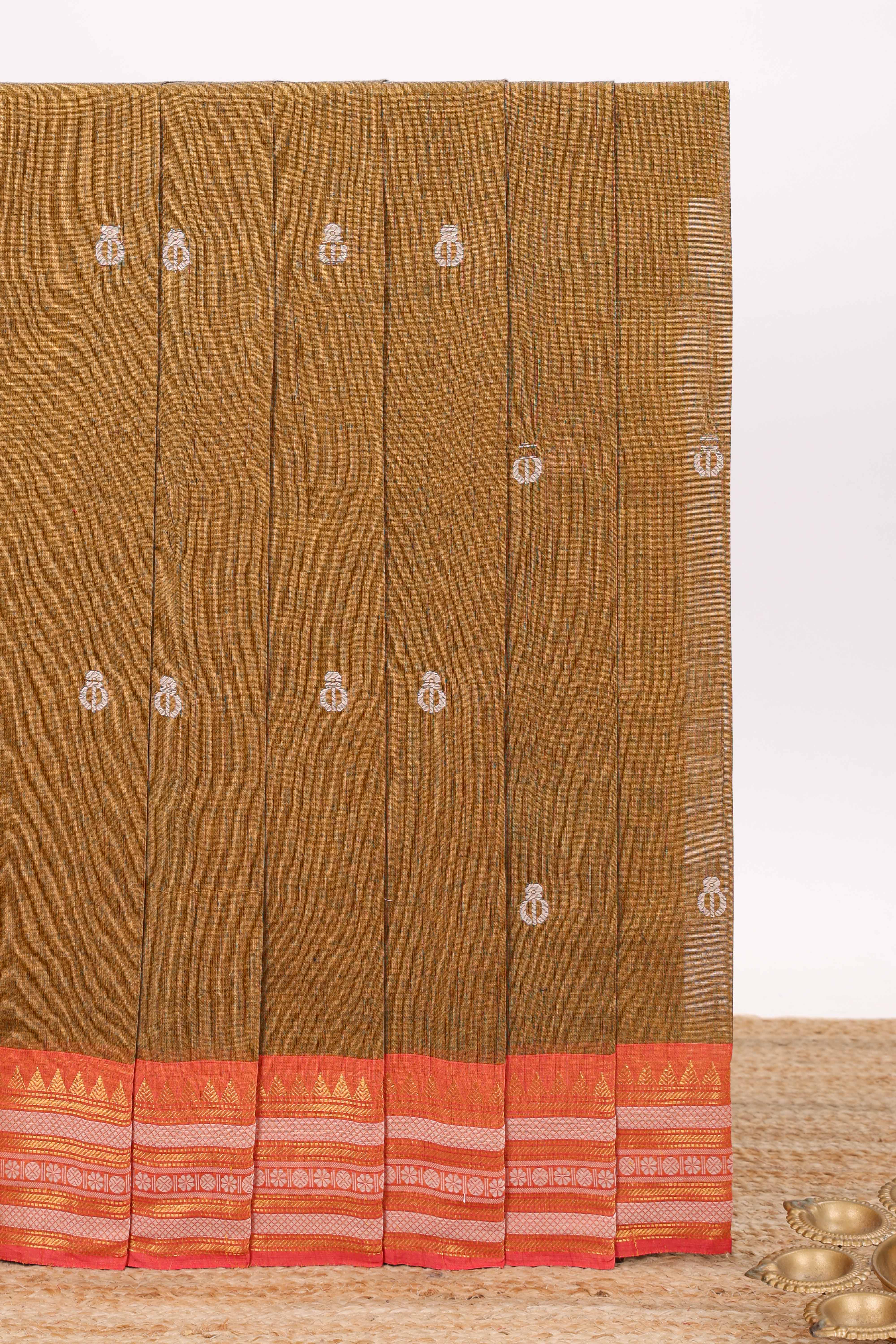 Mustard brown butta designed chirala cotton saree with contrast border and blouse