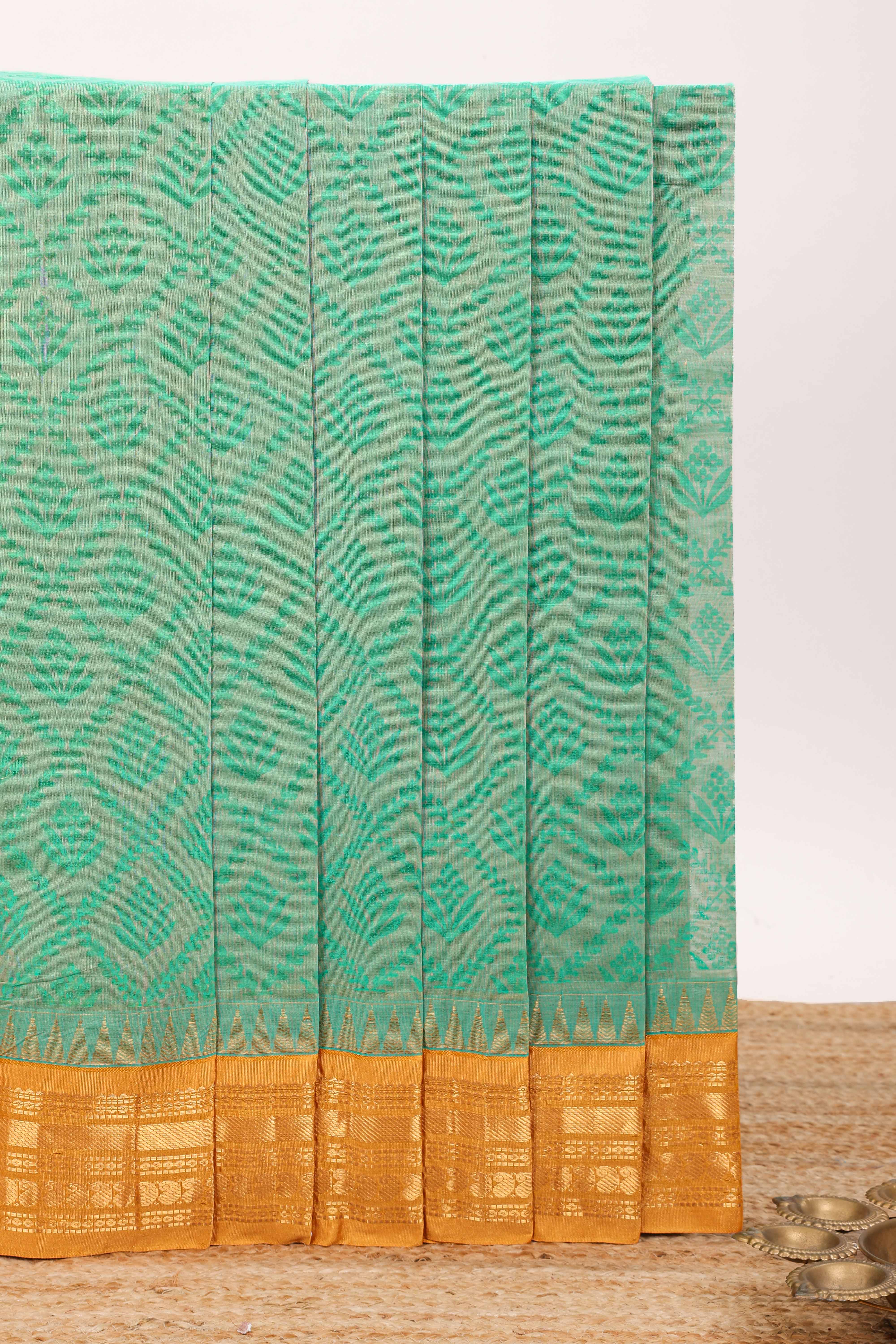 Jungle green geometric floral design chirala cotton saree with contrast border and zari design pallu