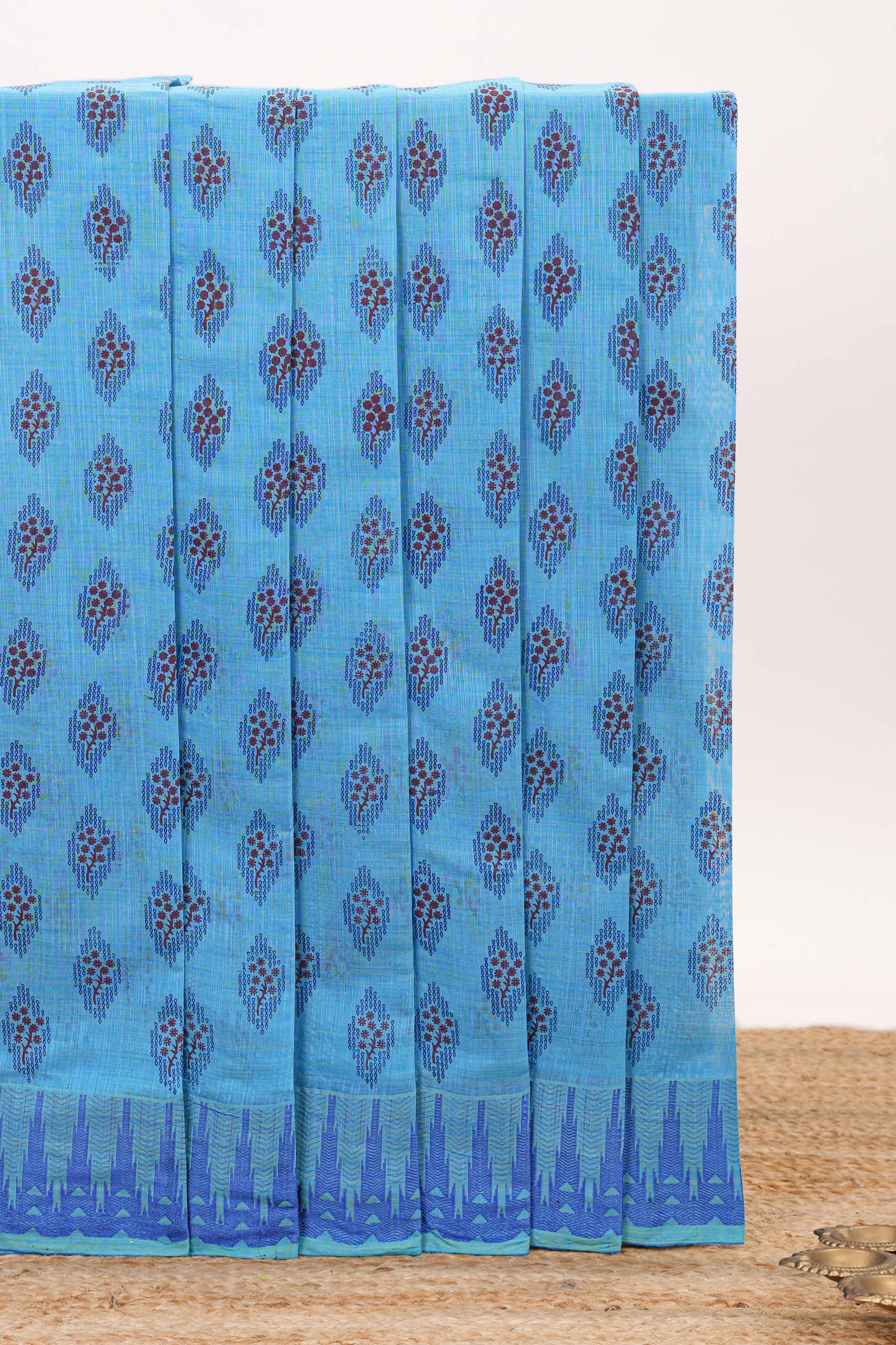 Blue butta design chirala cotton saree with self border and contrast blouse