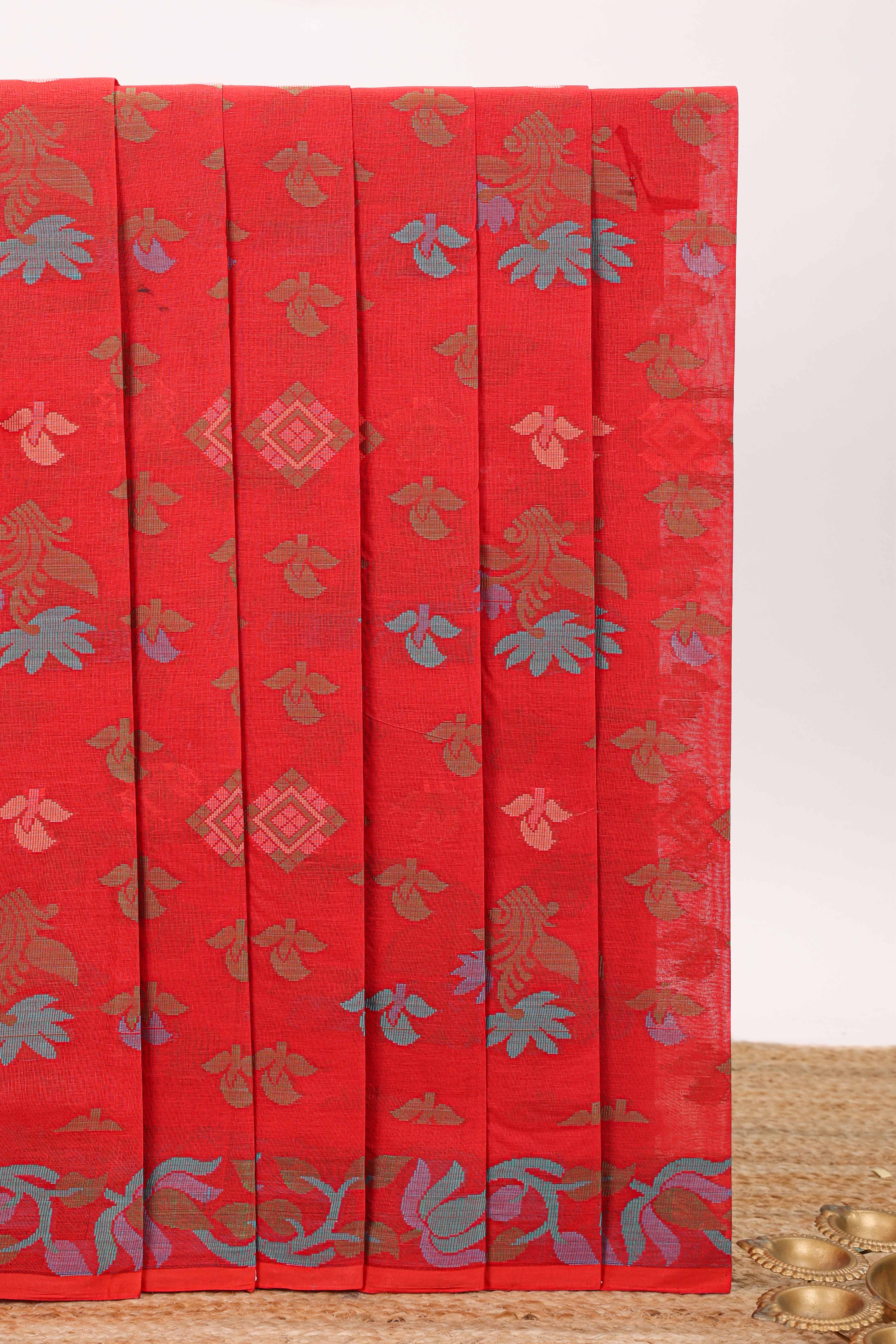 Red floral motifs design chirala cotton saree with self border and floral vine design pallu