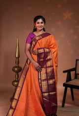 Orange plain chettinad cotton saree with contrast bentex zari border and striped pallu