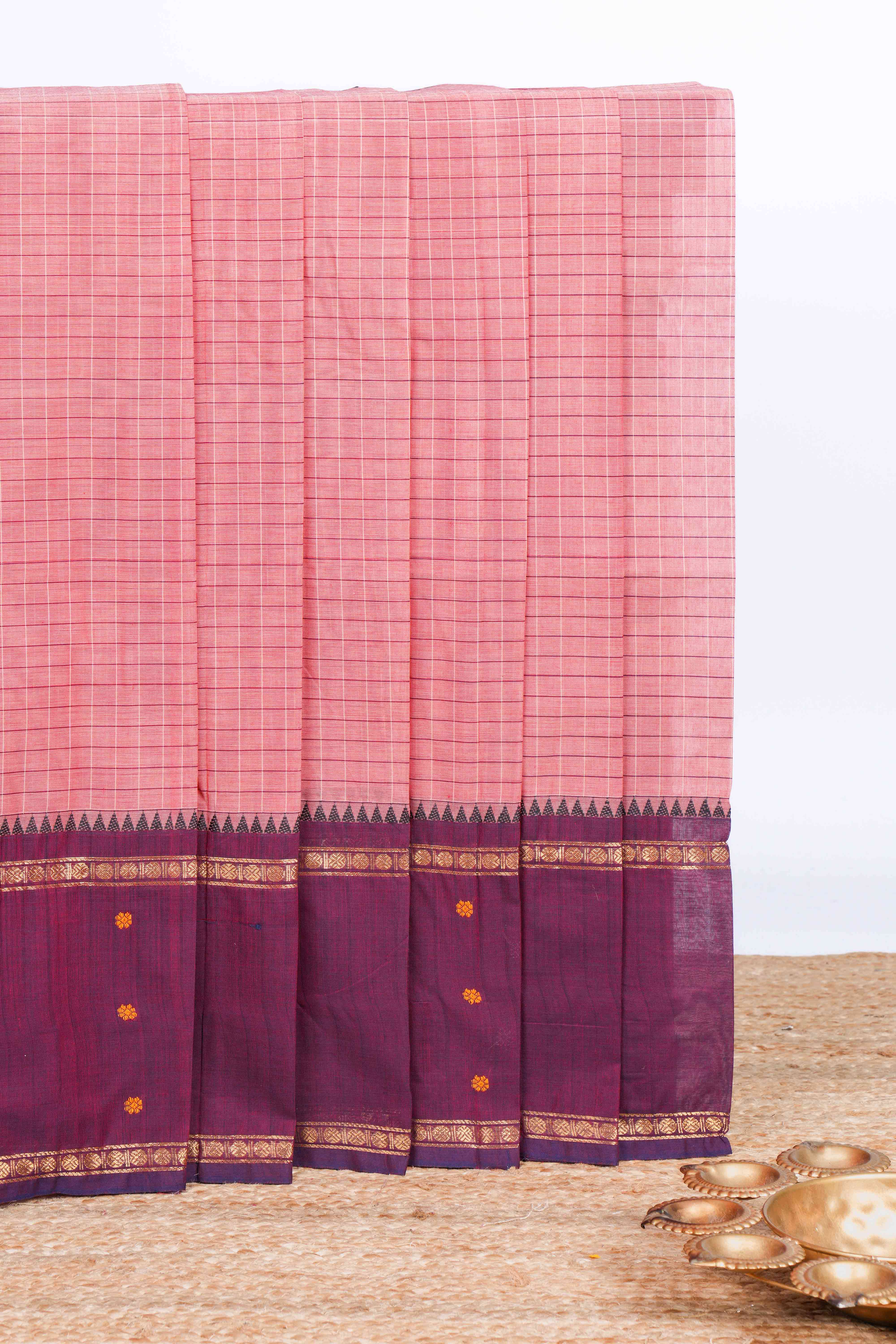 Peach checked chettinad cotton saree with contrast zari border and matching striped pallu