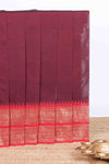 Maroon plain chettinad cotton saree with contrast zari border and matching striped pallu