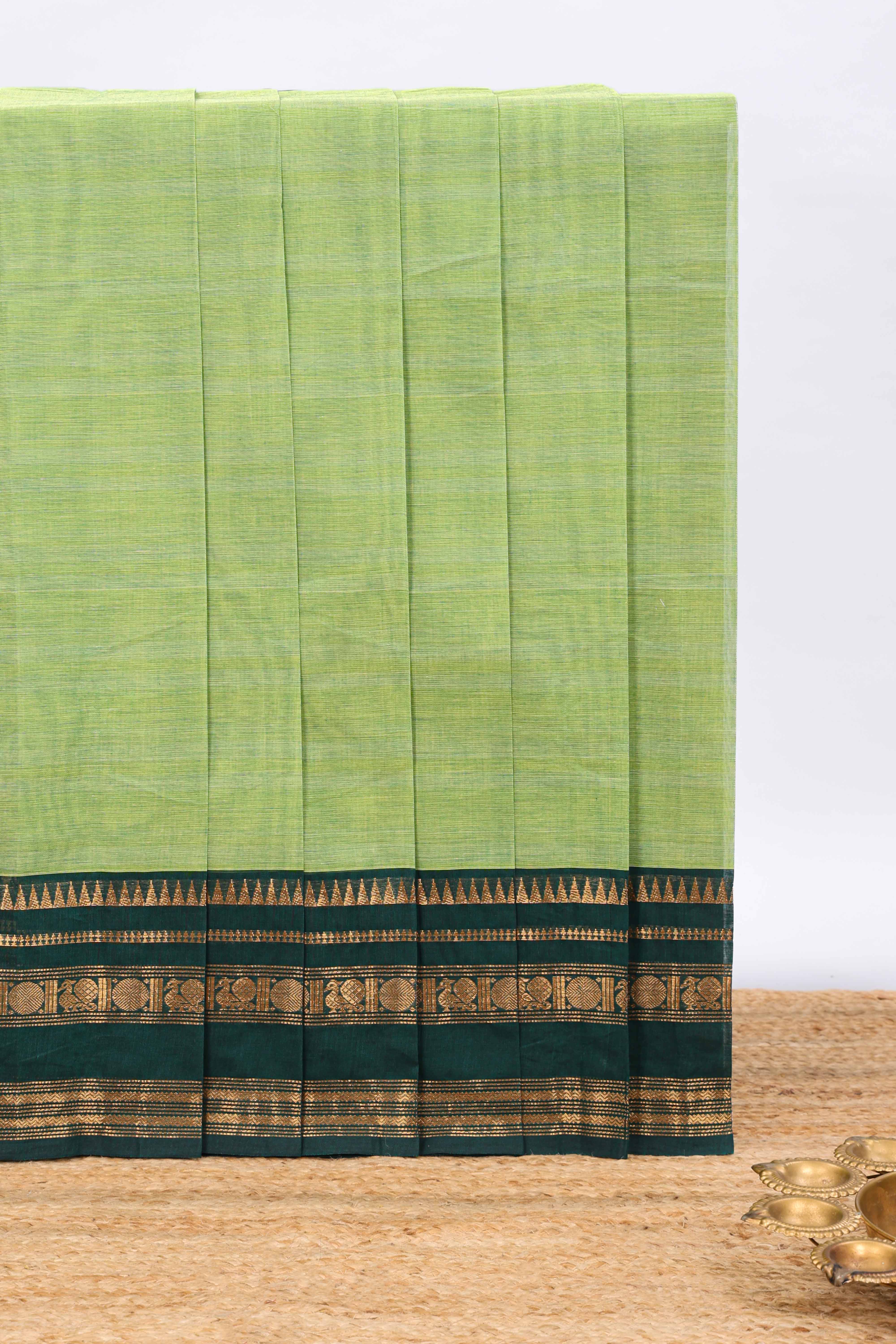 Green plain chettinad cotton saree with contrast zari border and matching blouse