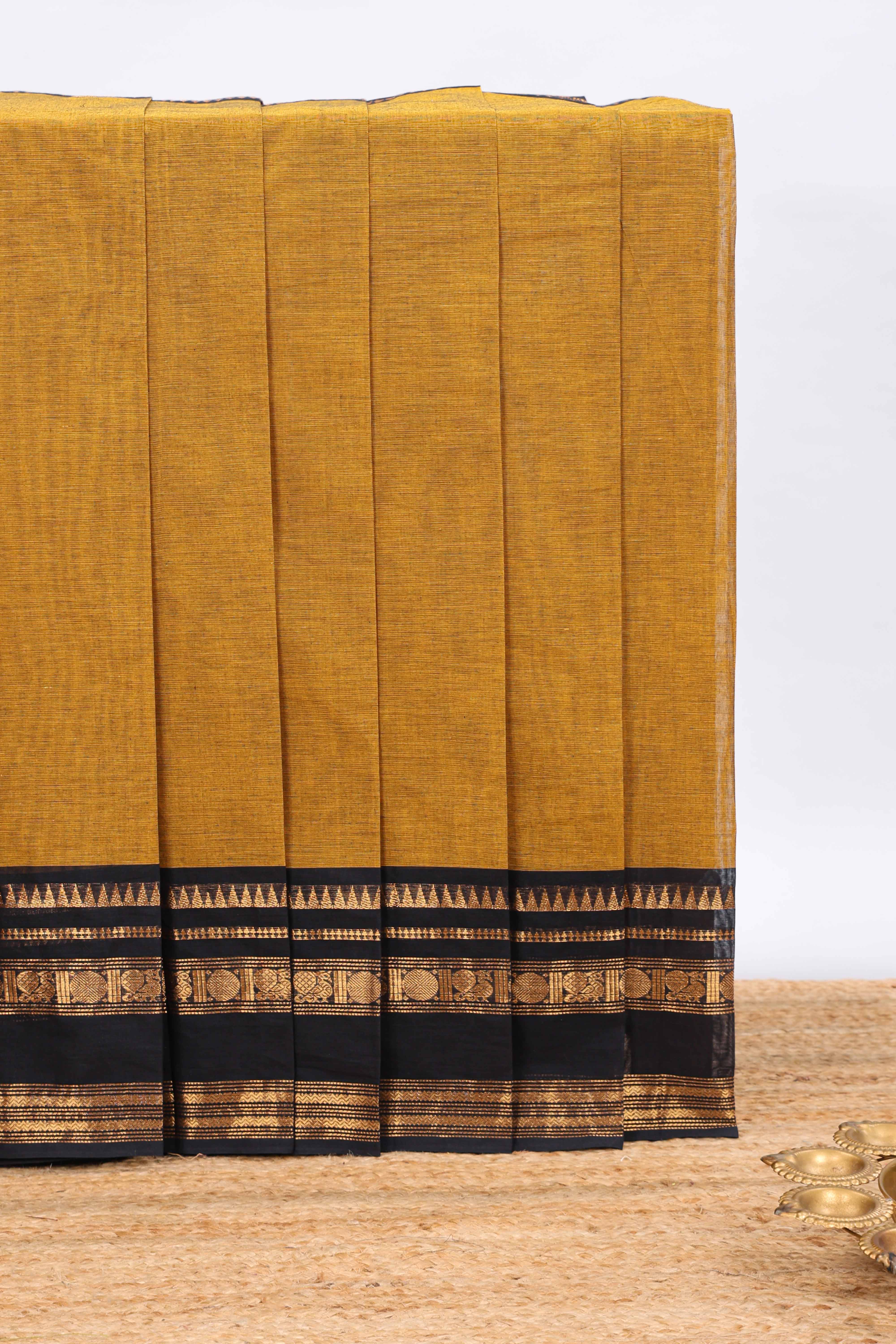 Mustard plain chettinad cotton saree with contrast zari border and matching blouse