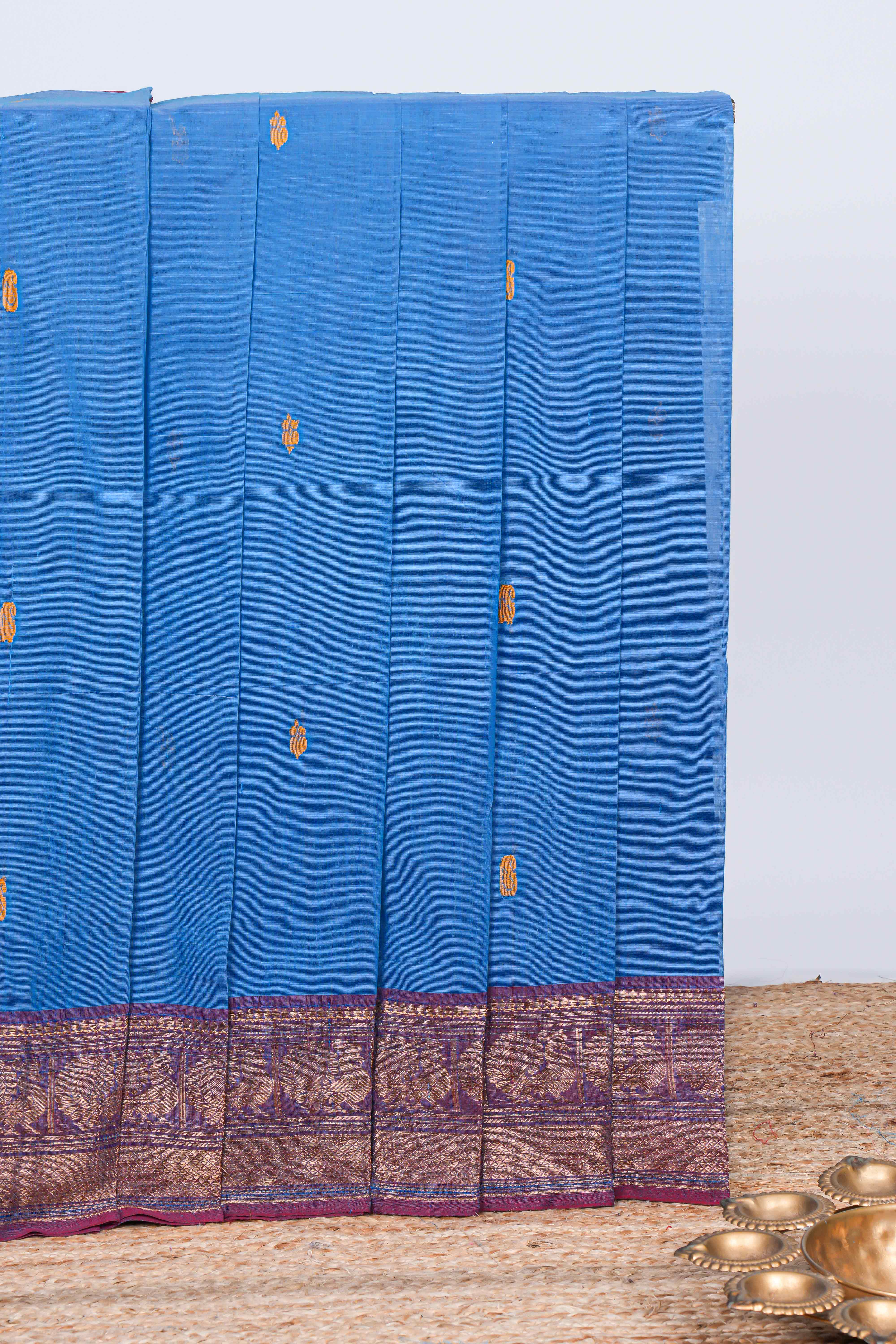 Blue thread motifs chettinad cotton saree with contrast checked border and matching striped pallu