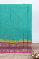 Turquoise green thread butta chettinad cotton saree with contrast border and matching striped pallu