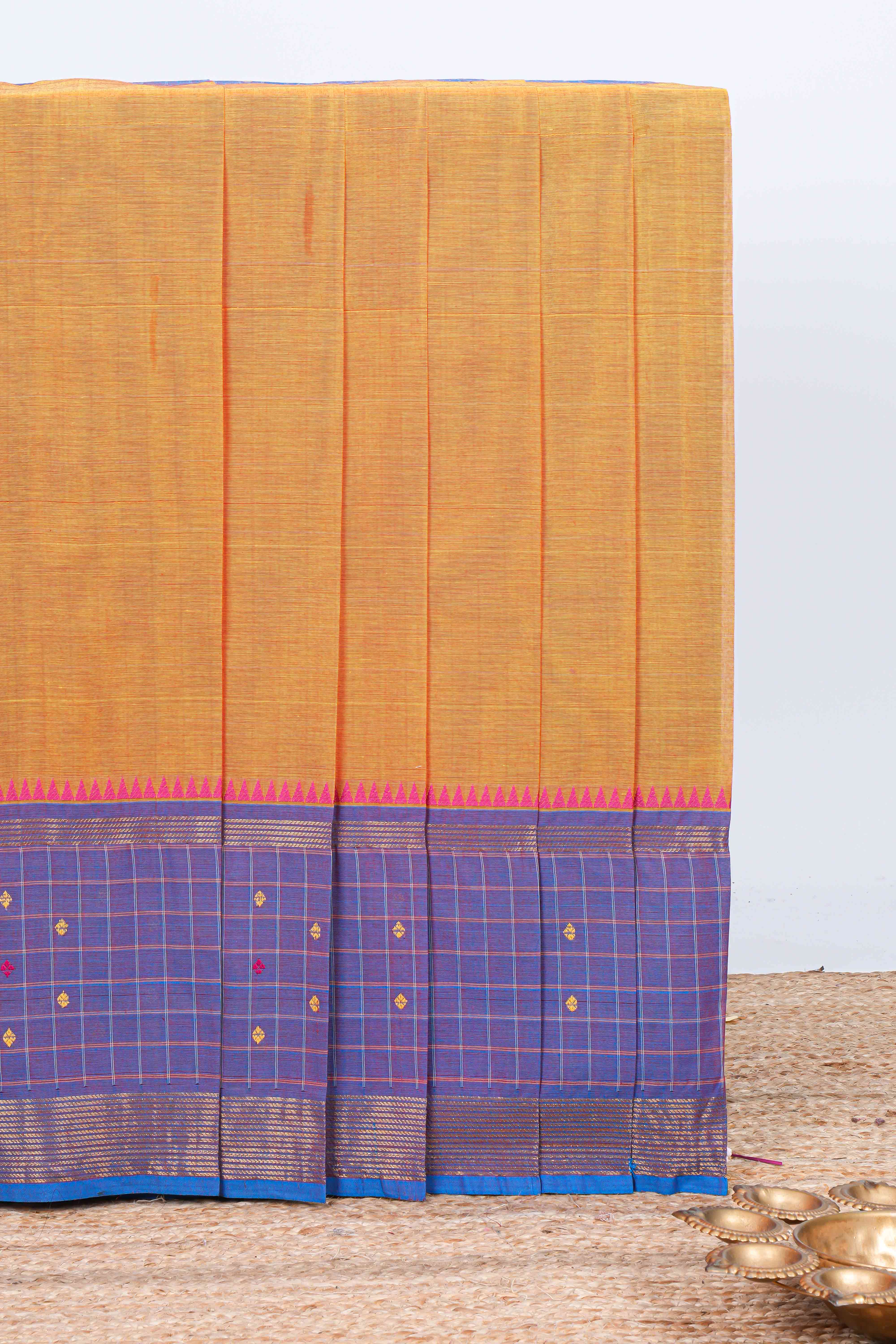Orange plain chettinad cotton saree with contrast checked border and matching striped pallu