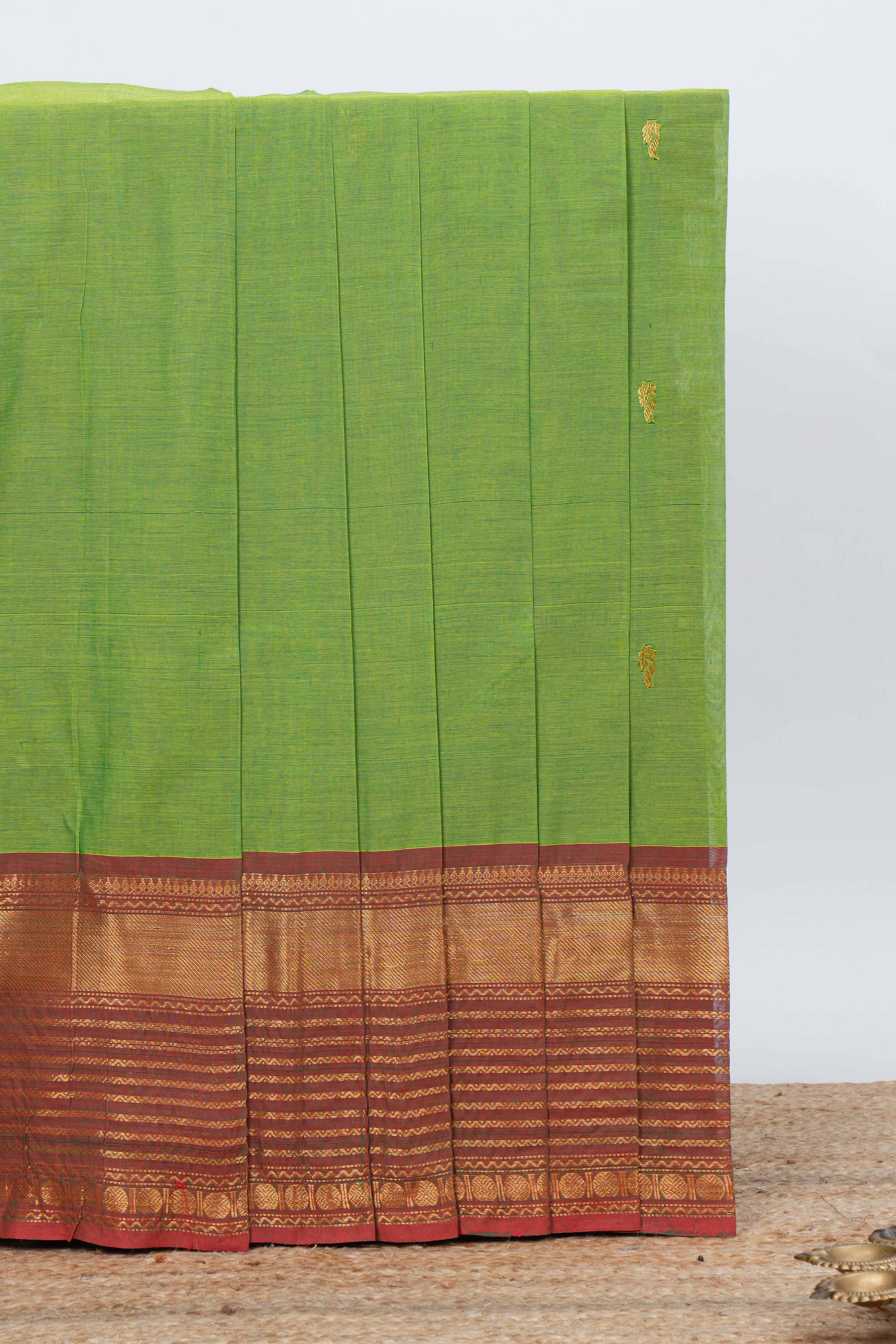 Parrotgreen colour chettinad cotton saree all over thread butta with contrast border and matching pallu along with blouse
