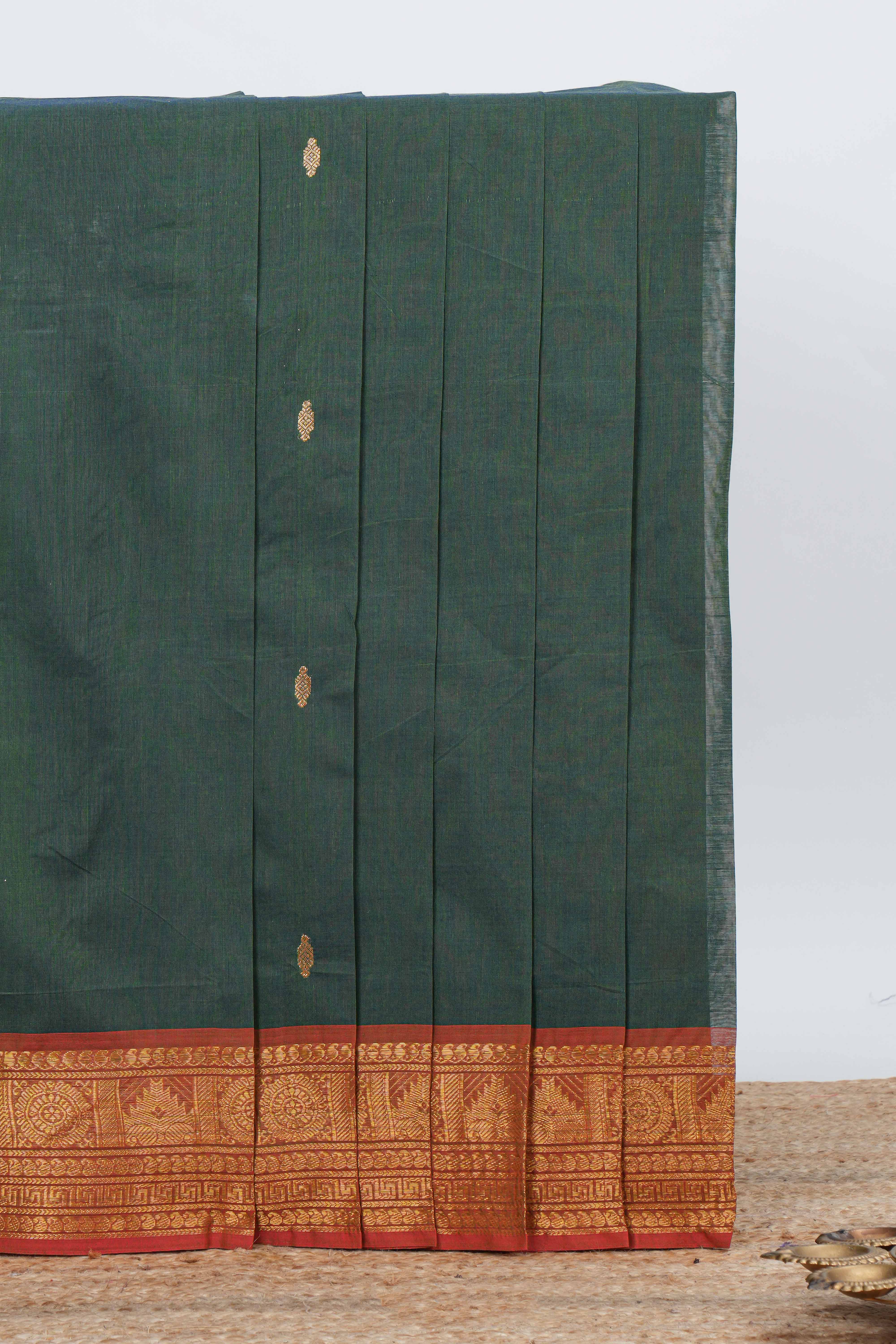Bottle green colour chettinad cotton saree all over thread butta with contrast border and zari pallu along with blouse